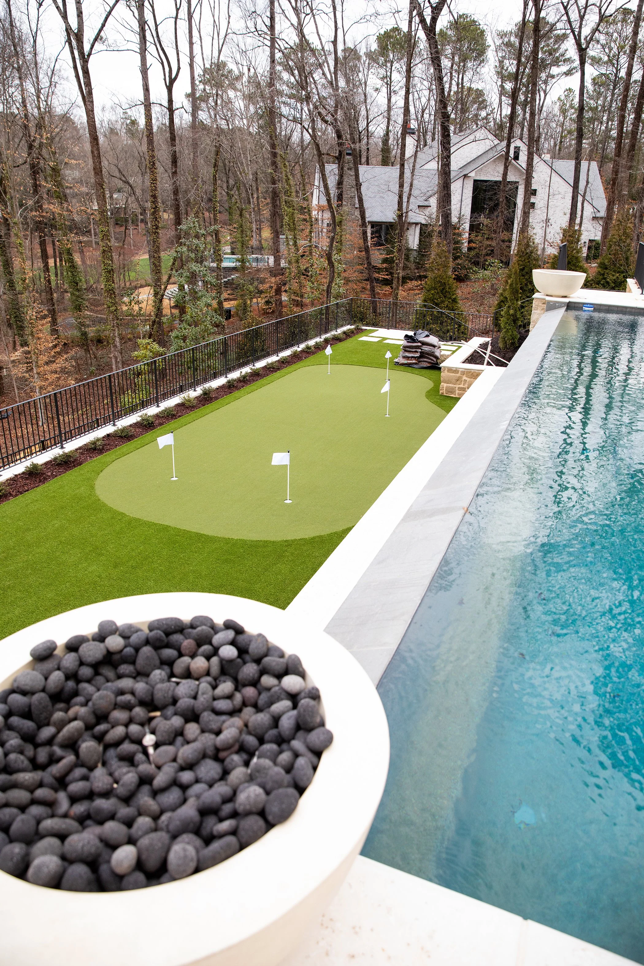 pickle ball court, pool, fire pit, patio, outdoor living Built or renovated by Macallan Custom Homes in Atlanta, GA. Custom Home and Renovations Builder