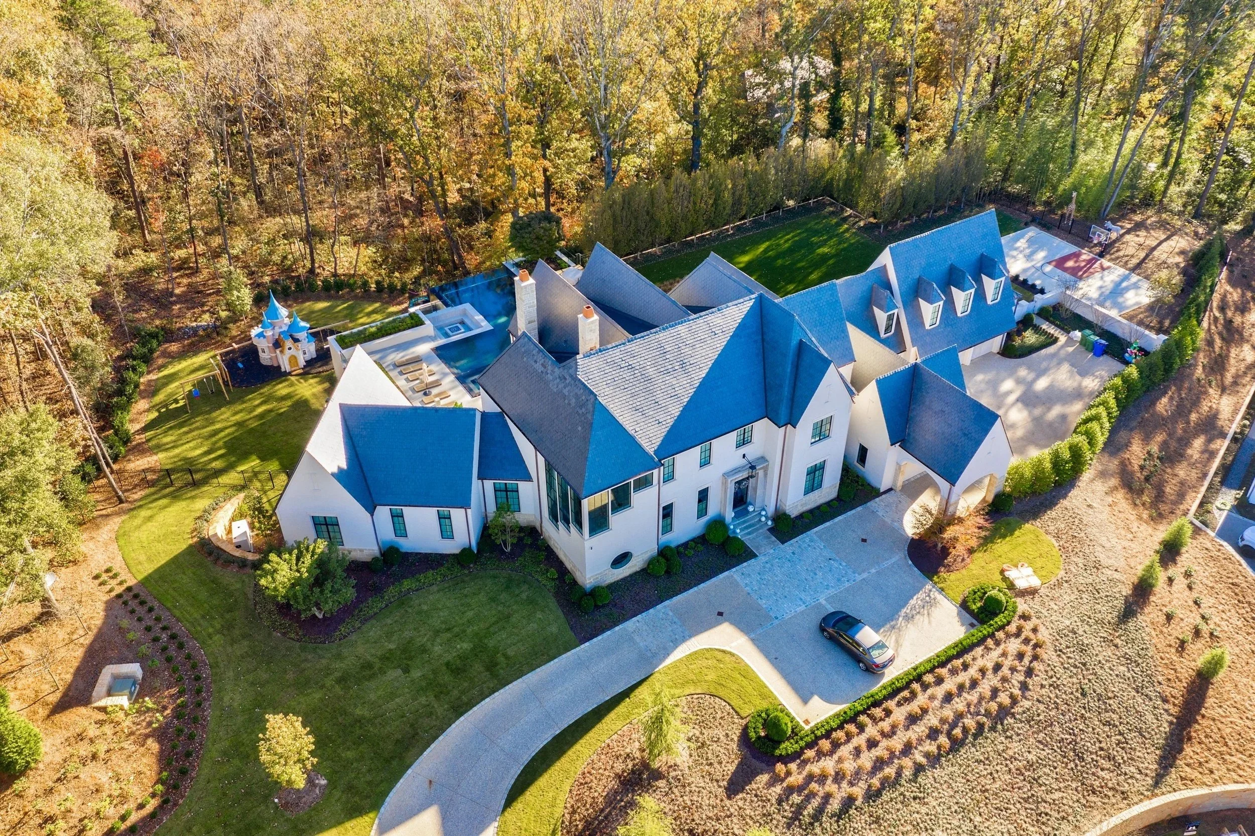 Large custom home, pool, playhouse, 4 car garage, custom windows and doors, basketball court Built or renovated by Macallan Custom Homes in Atlanta, GA. Custom Home and Renovations Builder