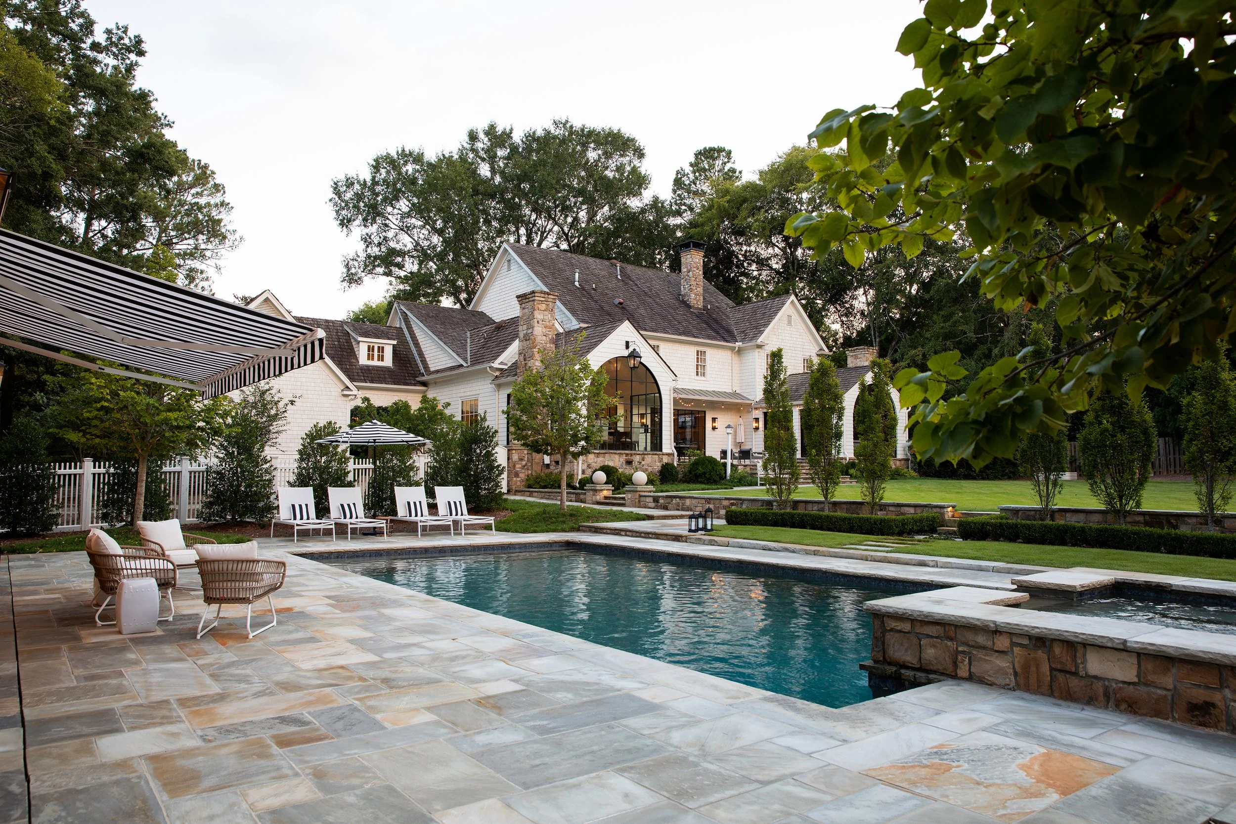 Exterior rear of house, pool, patio, landscaping Whole house renovation and addition pool, pool house, outdoor living Built or renovated by Macallan Custom Homes in Atlanta, GA. Custom Home and Renovations Builder