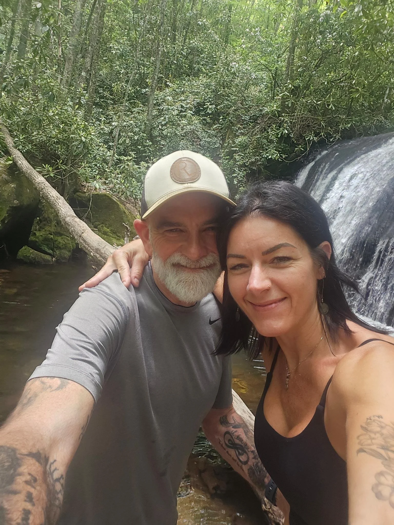 Man resting beside backpack during Self Love Retreat — a weekend of reflection, healing, and self-compassion in nature with Sacred Grit.