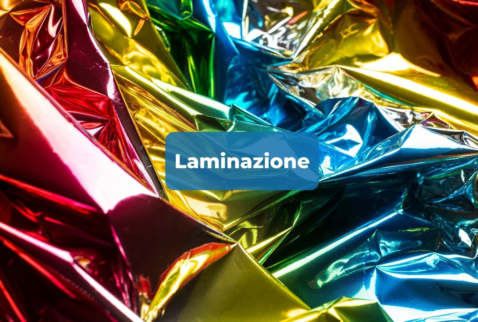 Piegature di fogli di lamina di diversi colori metallici, tra cui rosso, giallo, verde, blu e oro, con la parola 'Laminazione' in evidenza.