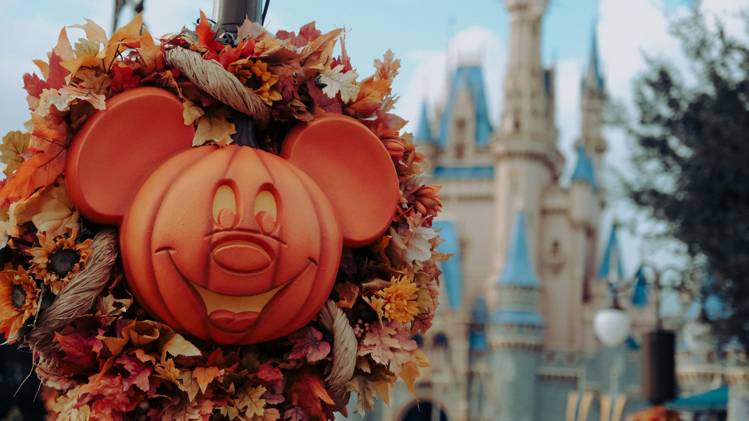 Friendly Mickey Halloween Pumpkin with Disney castle in background