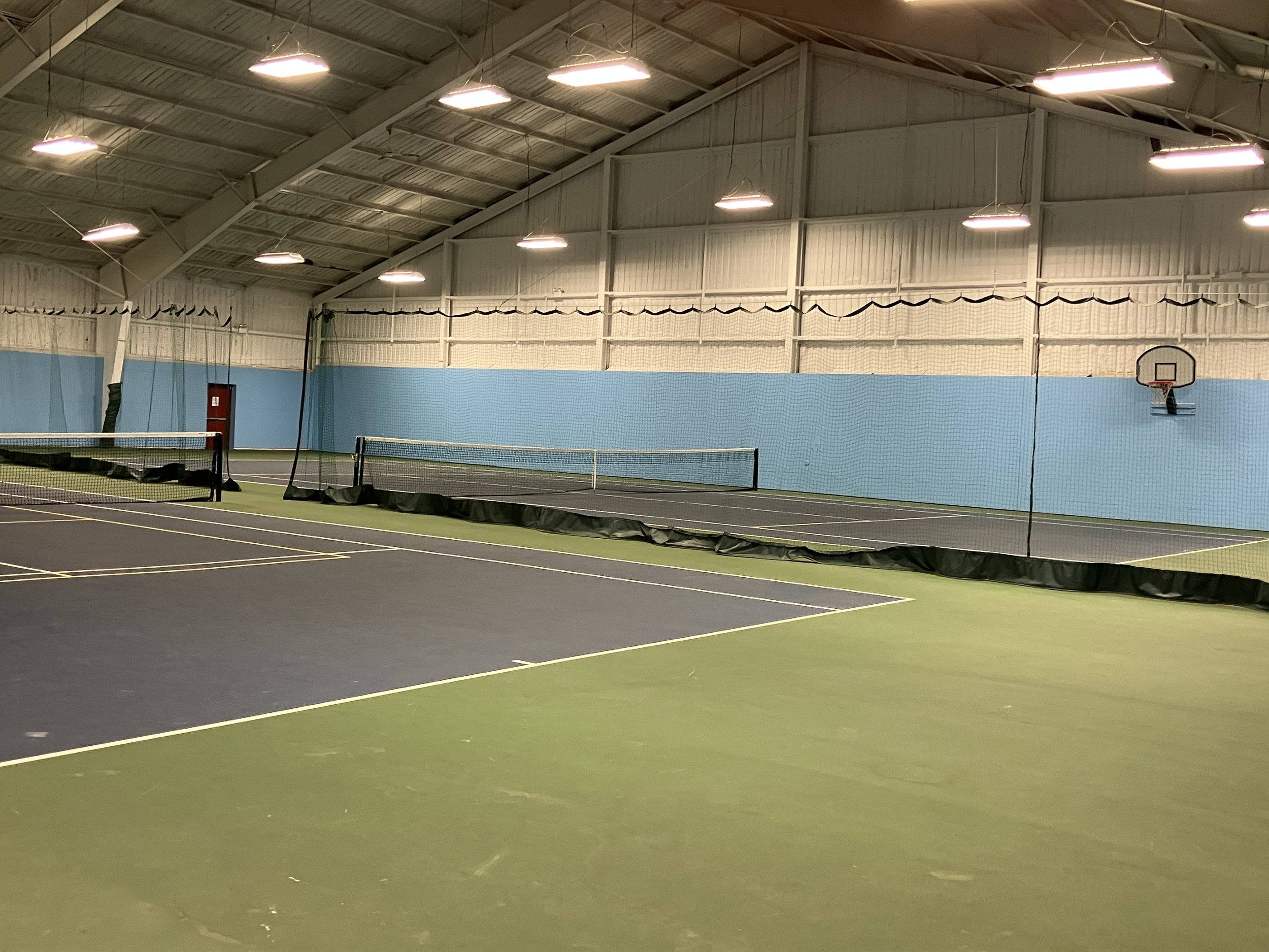 Amenity Sports Complex with inddor tennis and pickle ball courts and basketball court