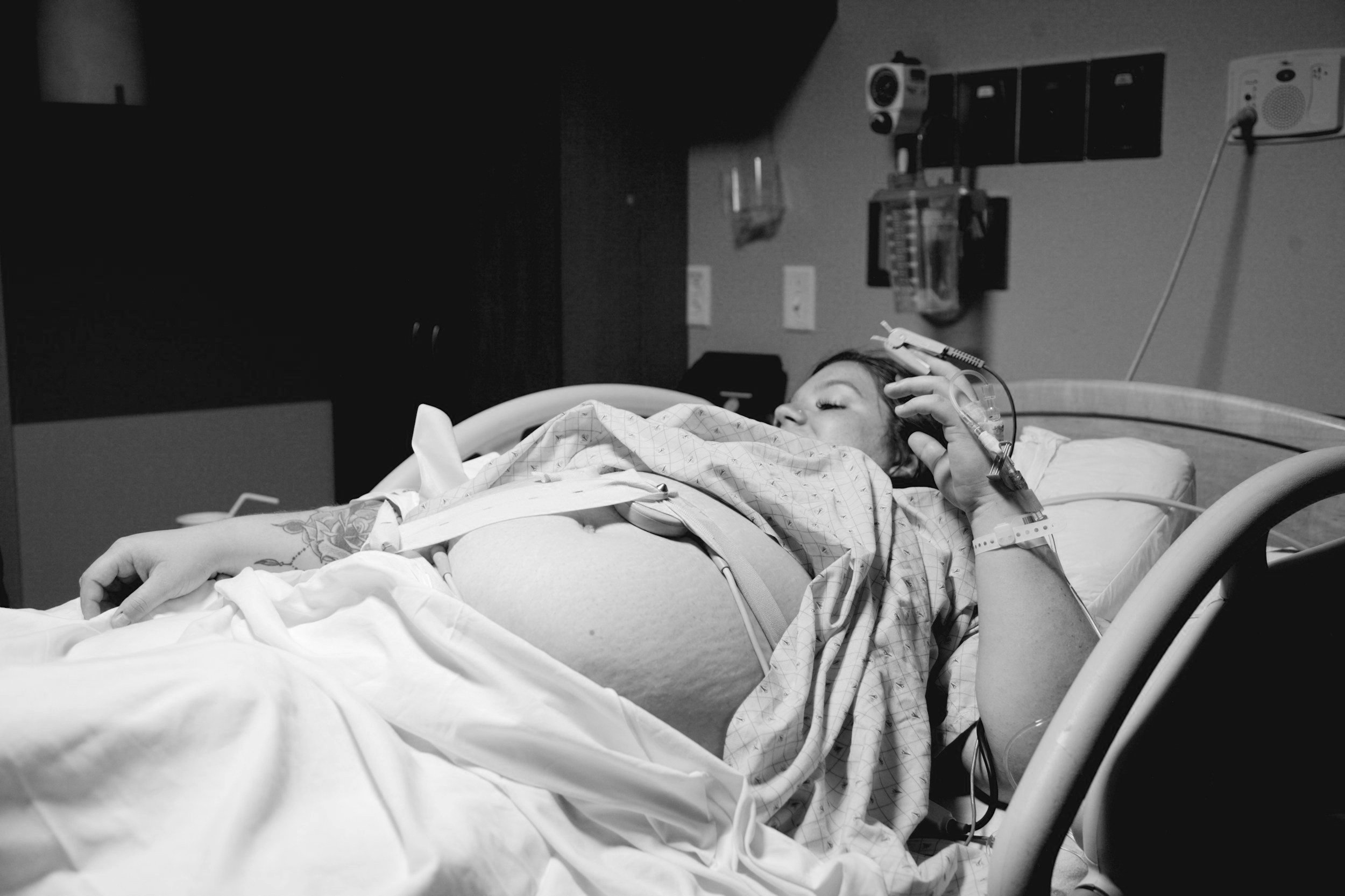 Pregnant woman in hospital bed during labor