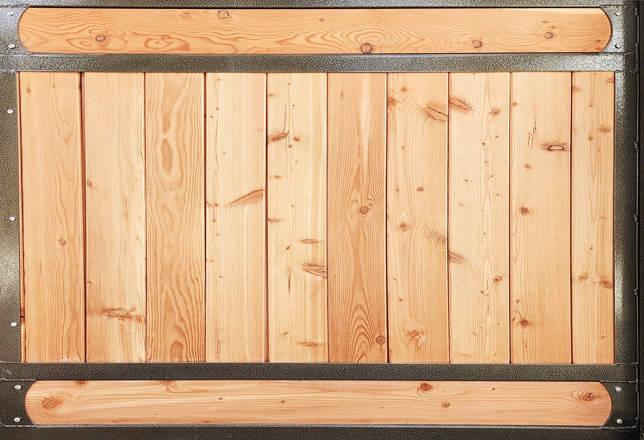 Wooden door with horizontal and vertical planks framed with black material