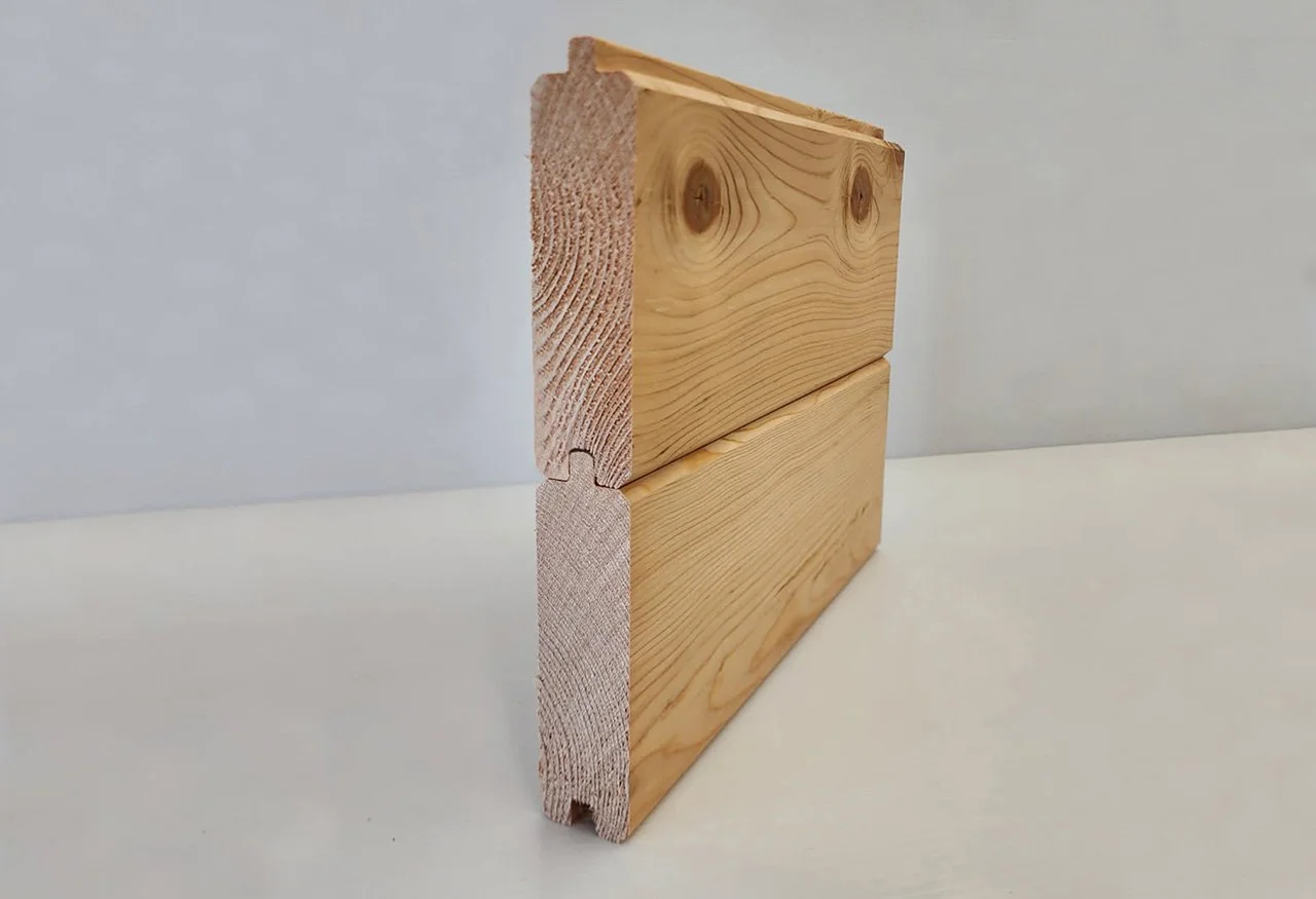 Two wooden planks stacked vertically on a white surface and background, one with visible wood grain and knots, the other with a rounded edge.