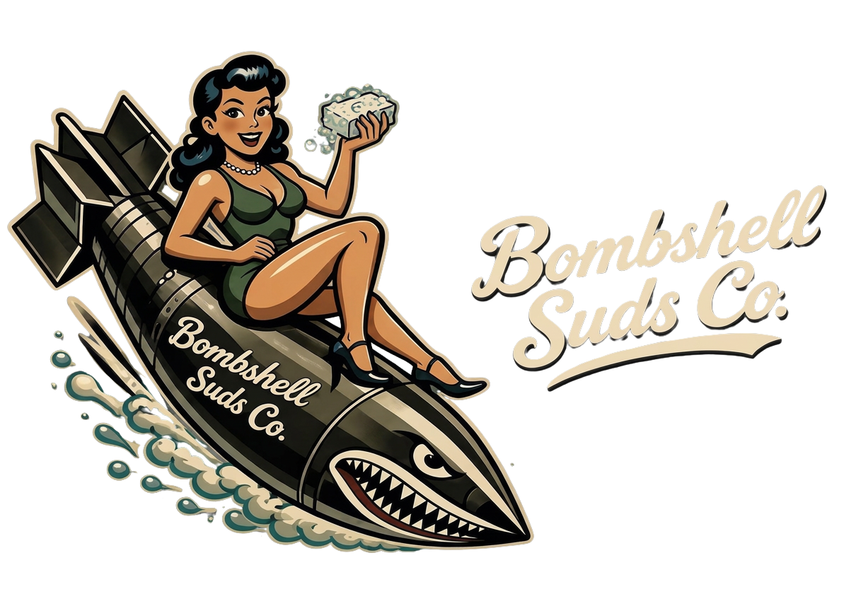 A vintage-style logo for Bombshell Suds Co. features a cartoon woman with dark hair, wearing a green dress and high heels, sitting on a large cartoon bomb with a shark face, holding a bar of soap. The text 'Bombshell Suds Co.' appears twice, once on the bomb and once next to it.