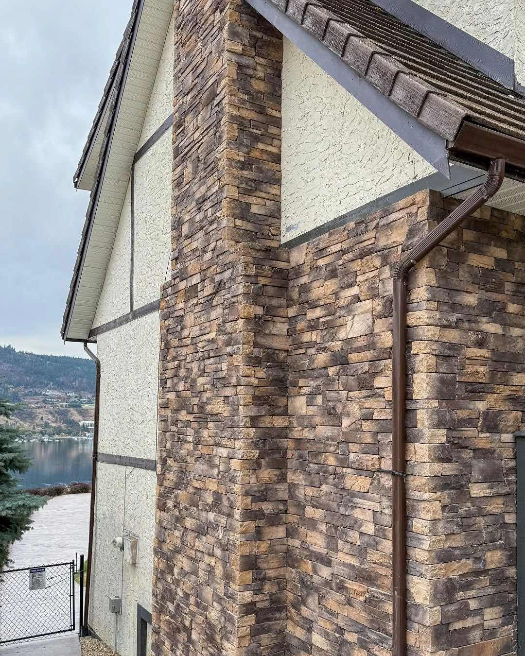 I also do exteriors! This lakeside home is getting a timeless update by creating harmony between existing materials and new finishes. Design plan includes new lighting, removal of dated and damaged materials, new siding, and paint. This quietly sophi