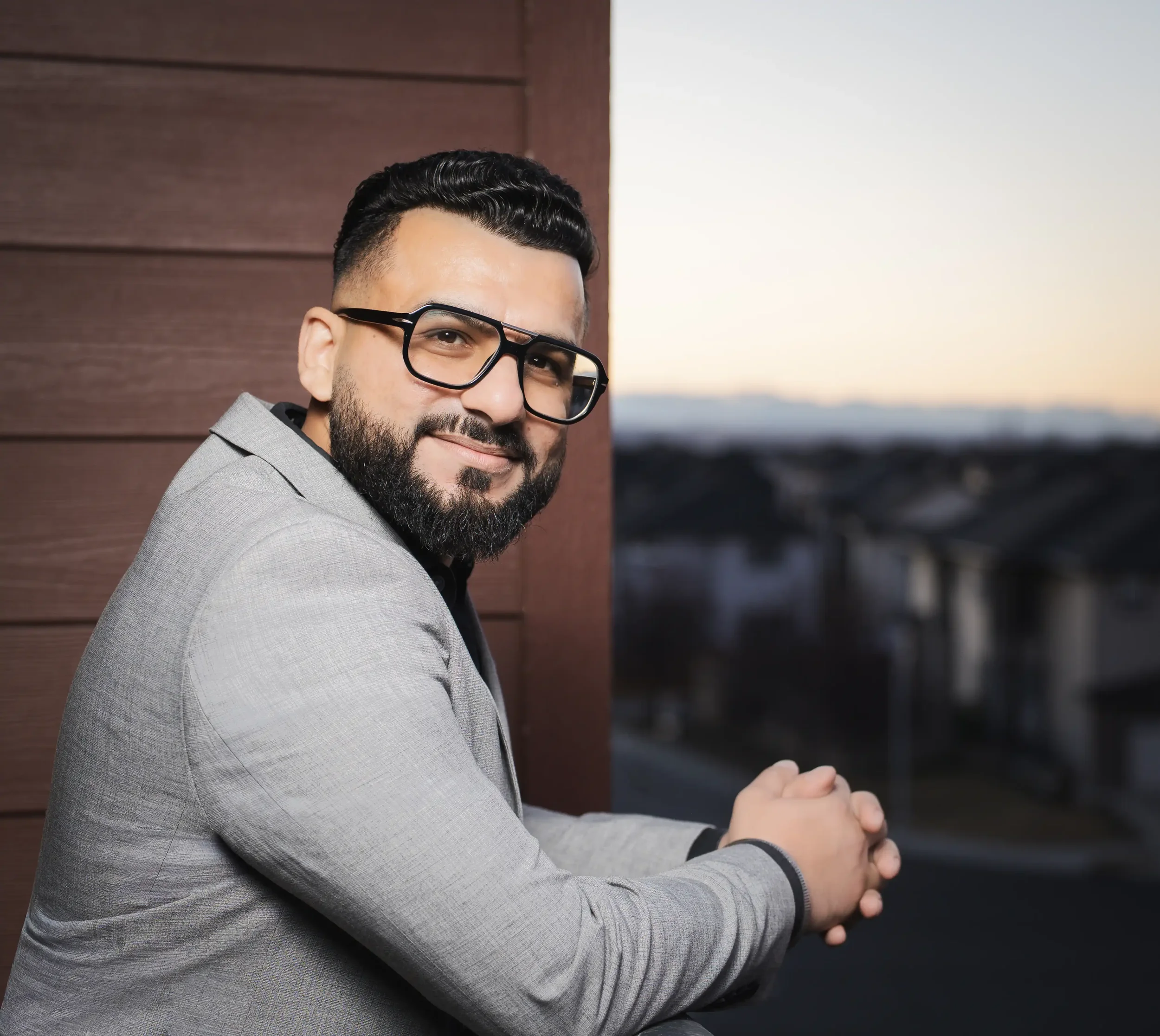 Portrait of a realtor on-site in Calgary, using soft lighting.