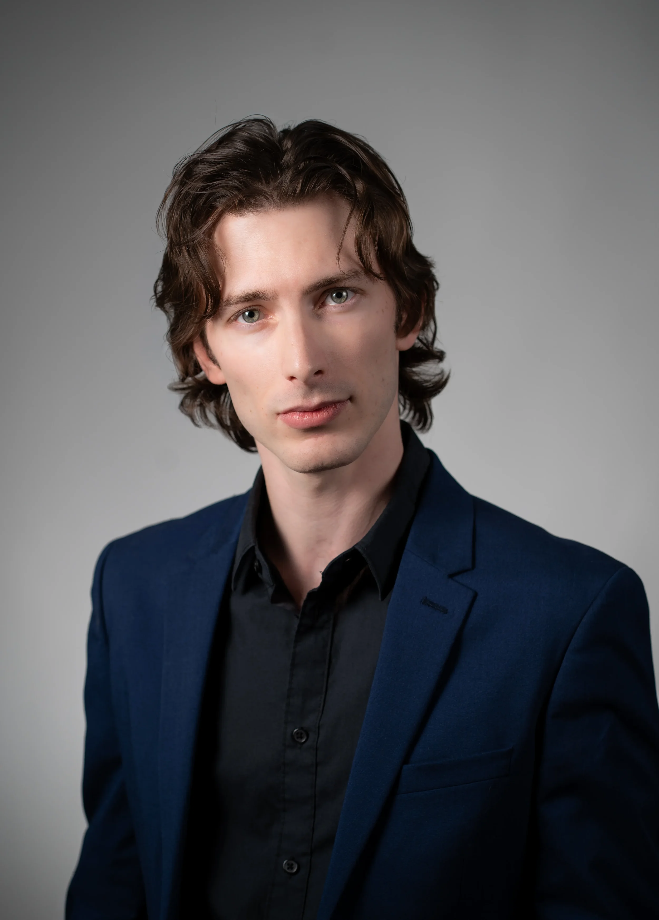 Professional headshot of a man in Calgary studio.