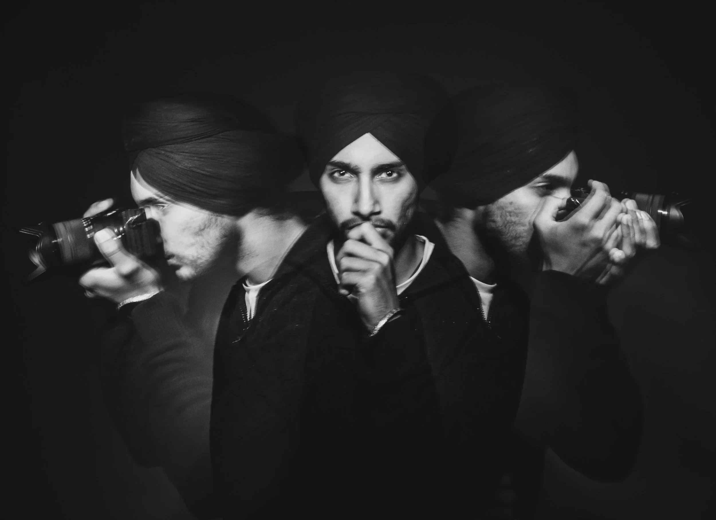 Branding photograph of a professional photographer in a Calgary studio using light painting. 