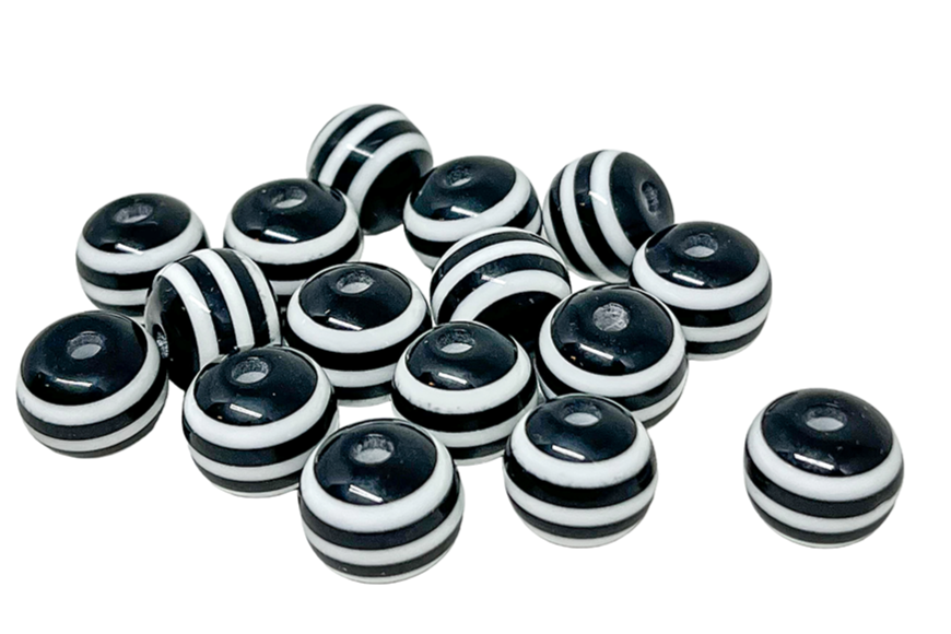 A collection of black and white striped round beads on a white background.
