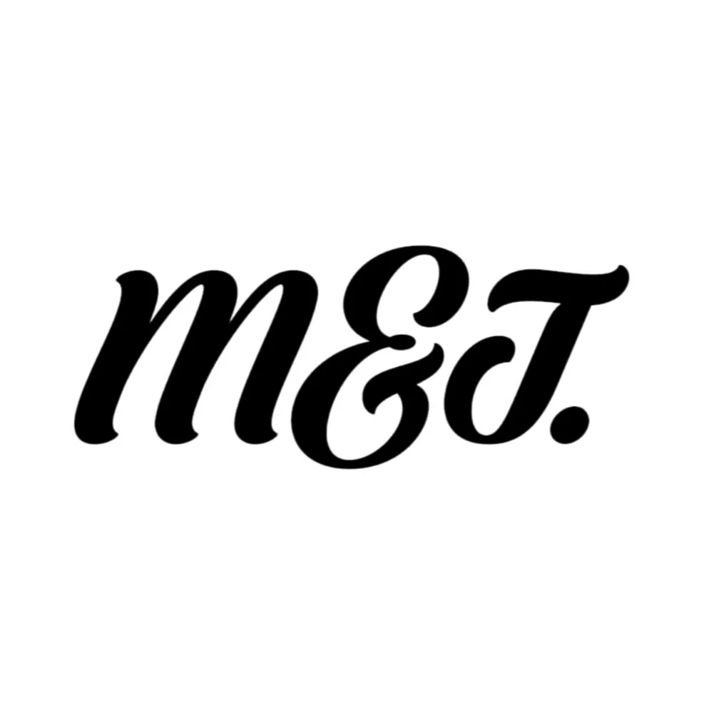 Stylised text "M&J" in cursive font