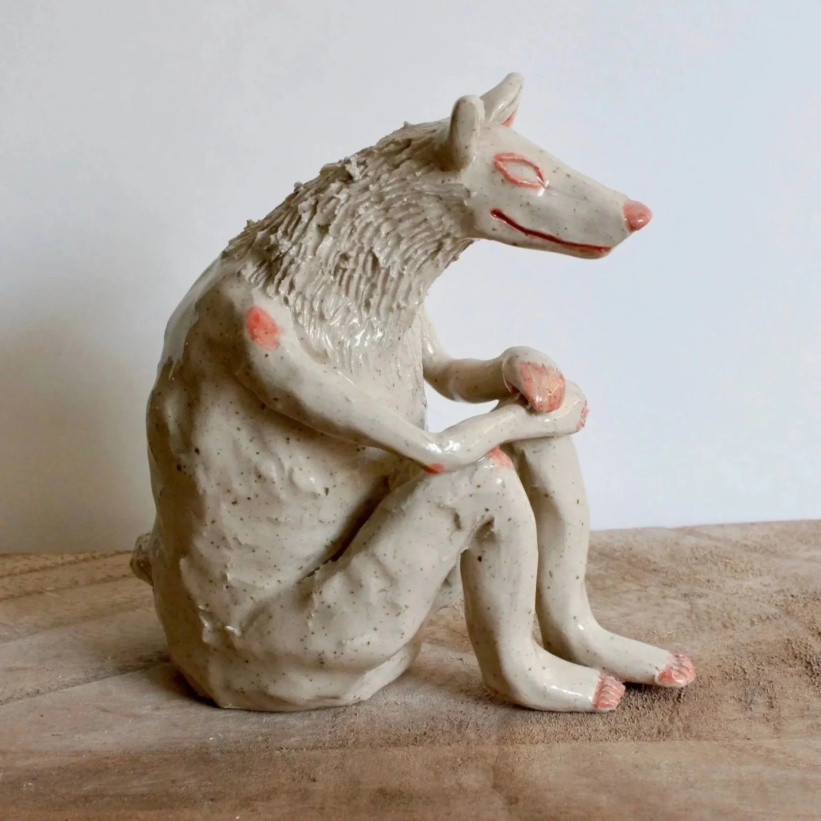 Stoneware sculpture (sitting wolf person)