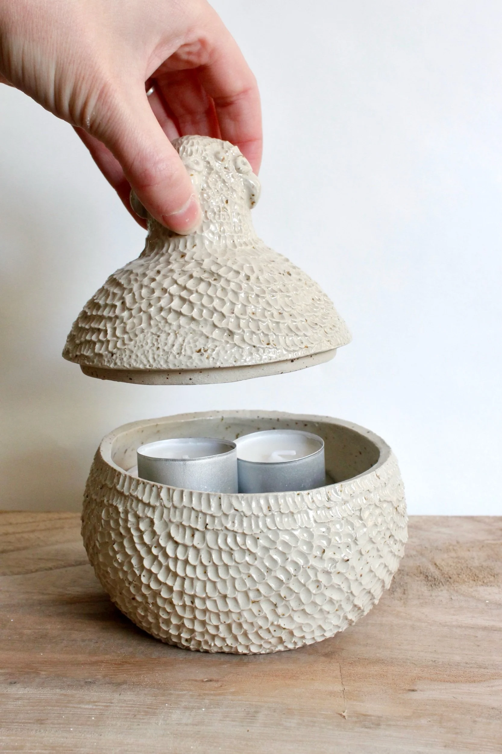 Stoneware textured bird head jar