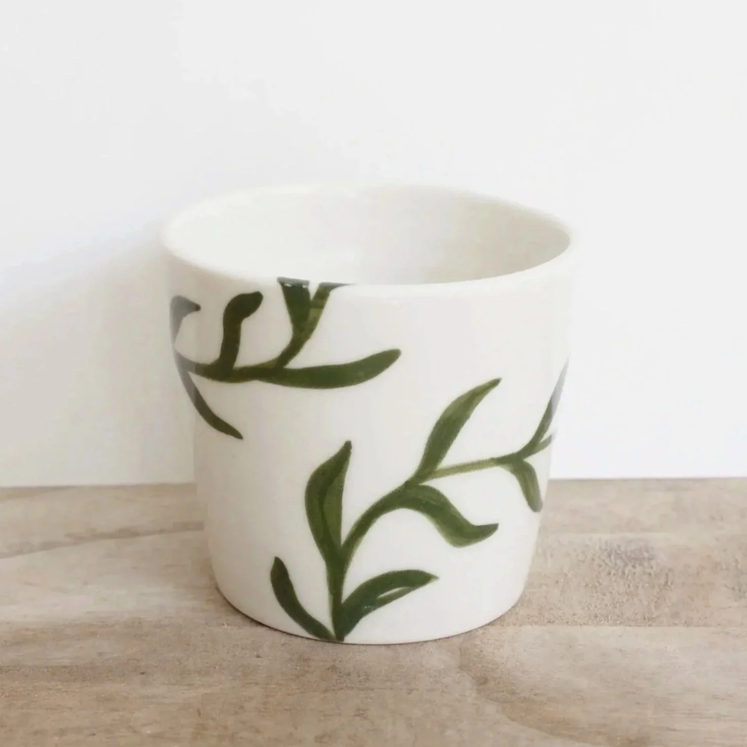 Porcelain cup with leaves