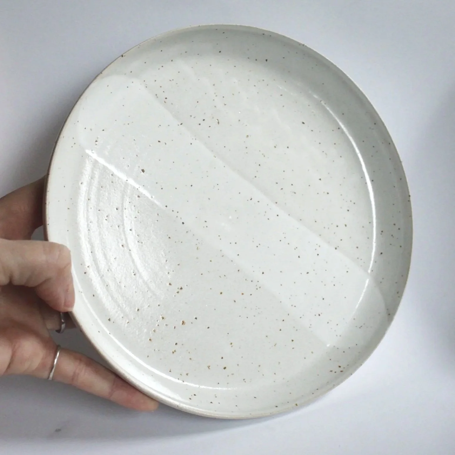 Stoneware plate glazed in white on white, 19,5 cm