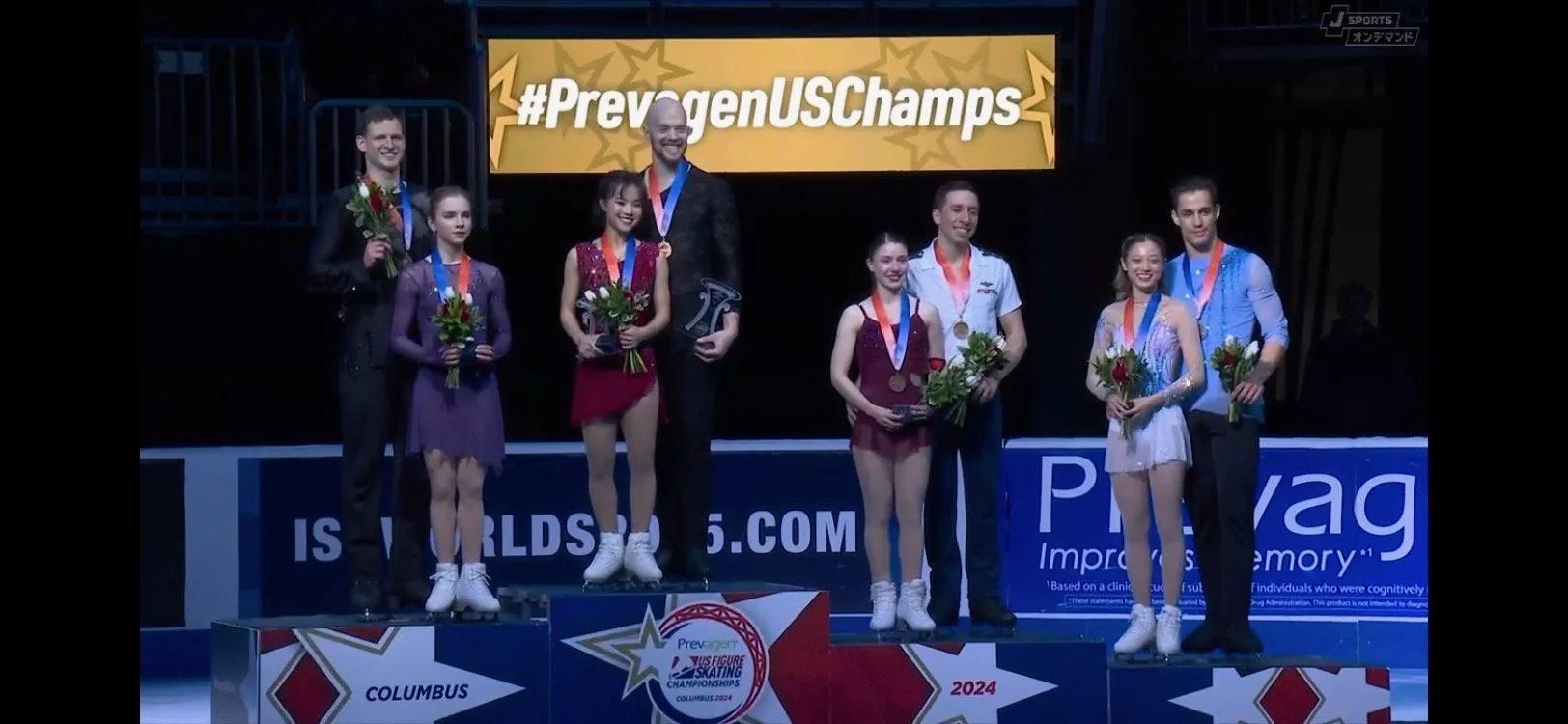 U.S. National Champions Ellie Kam & Danny O'Shea with their gold medals and other members of Team USA