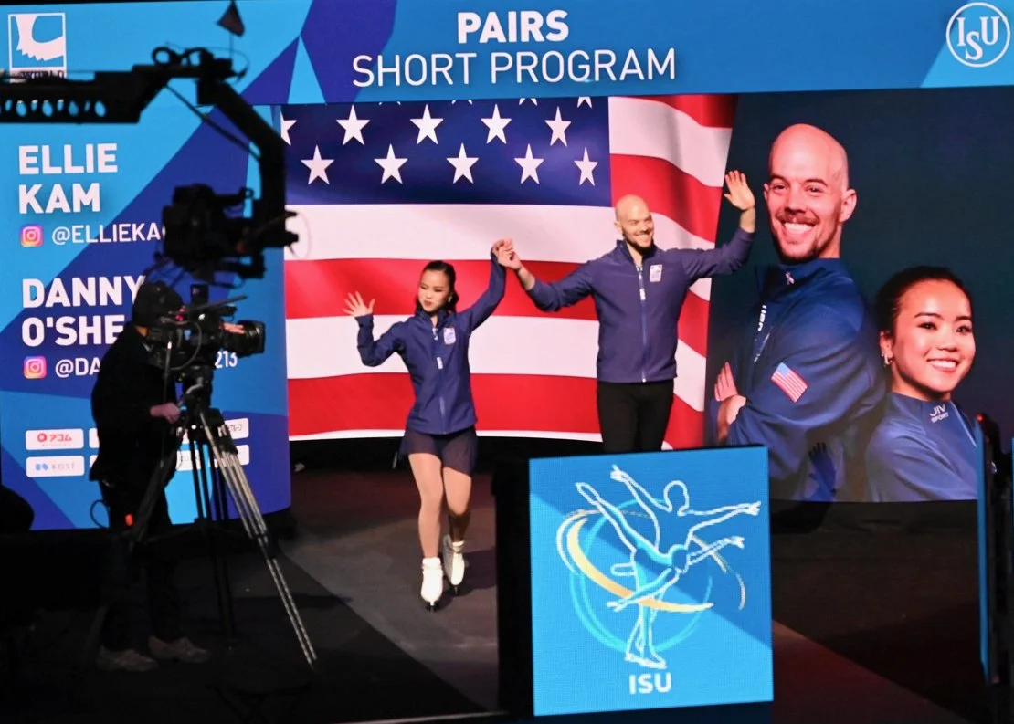 Ellie Kam & Danny O'Shea walking out onto the ice