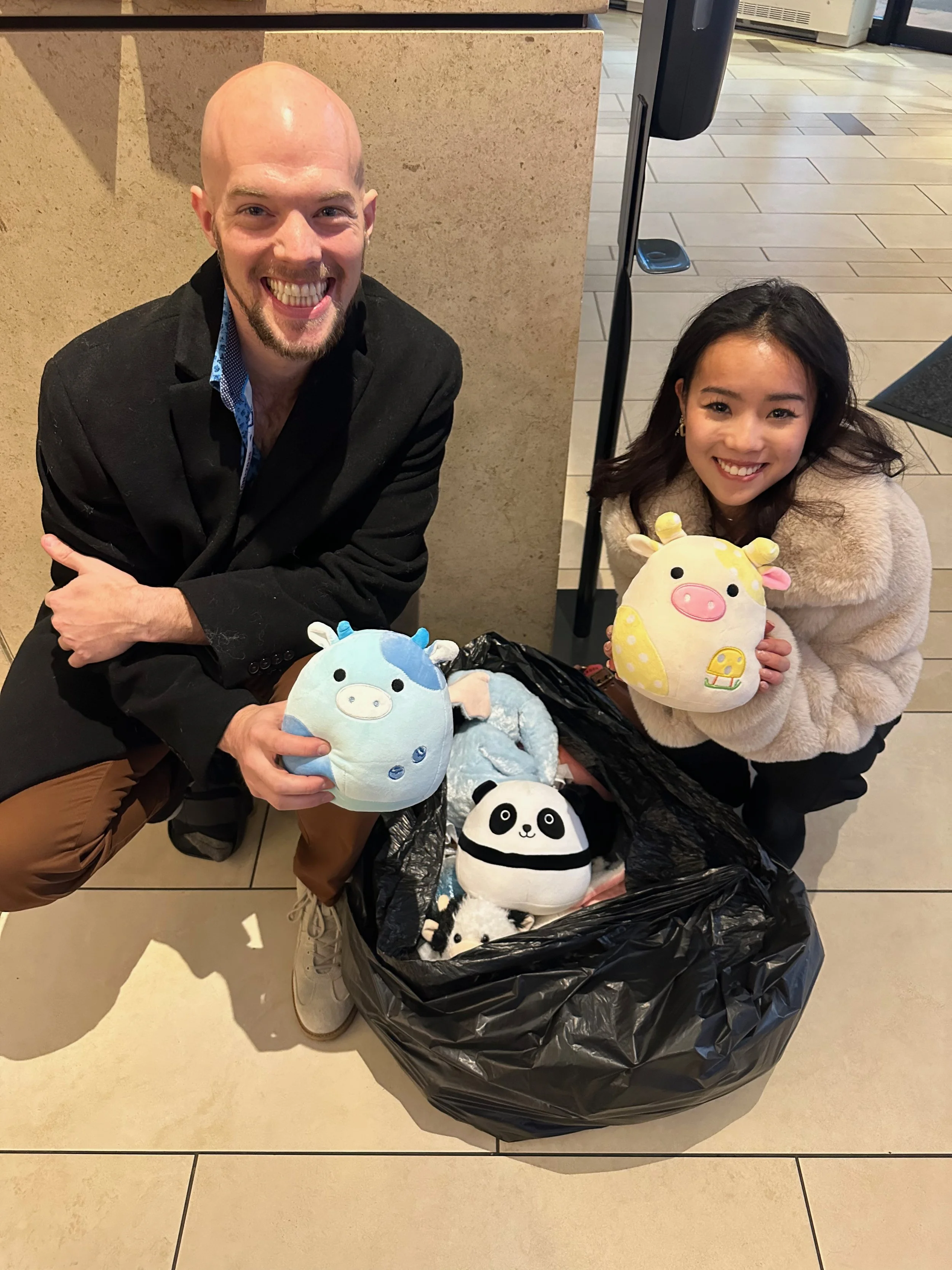 Ellie Kam & Danny O'Shea with stuffed animals