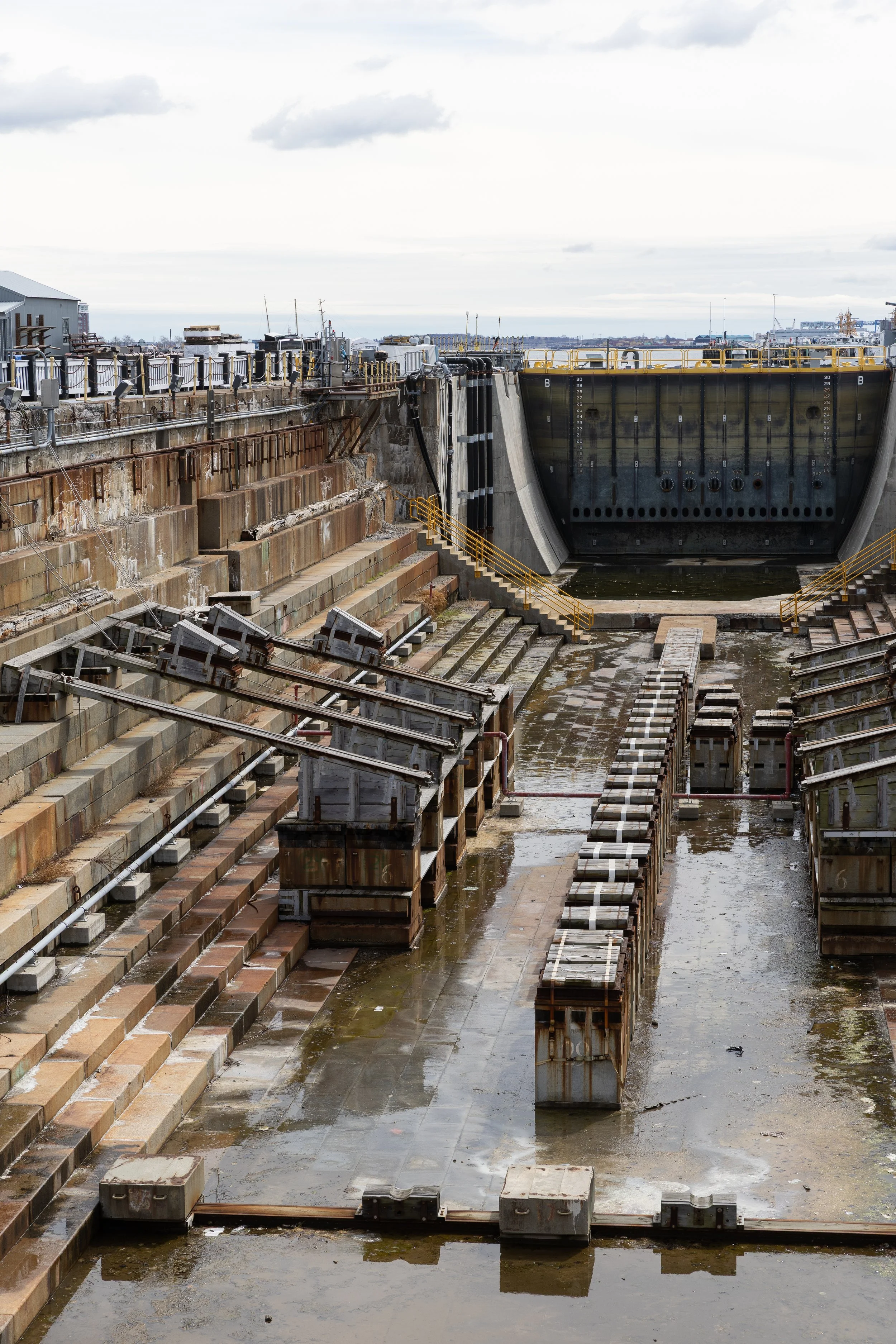 Dam gate and lock system with water and machinery in a waterway