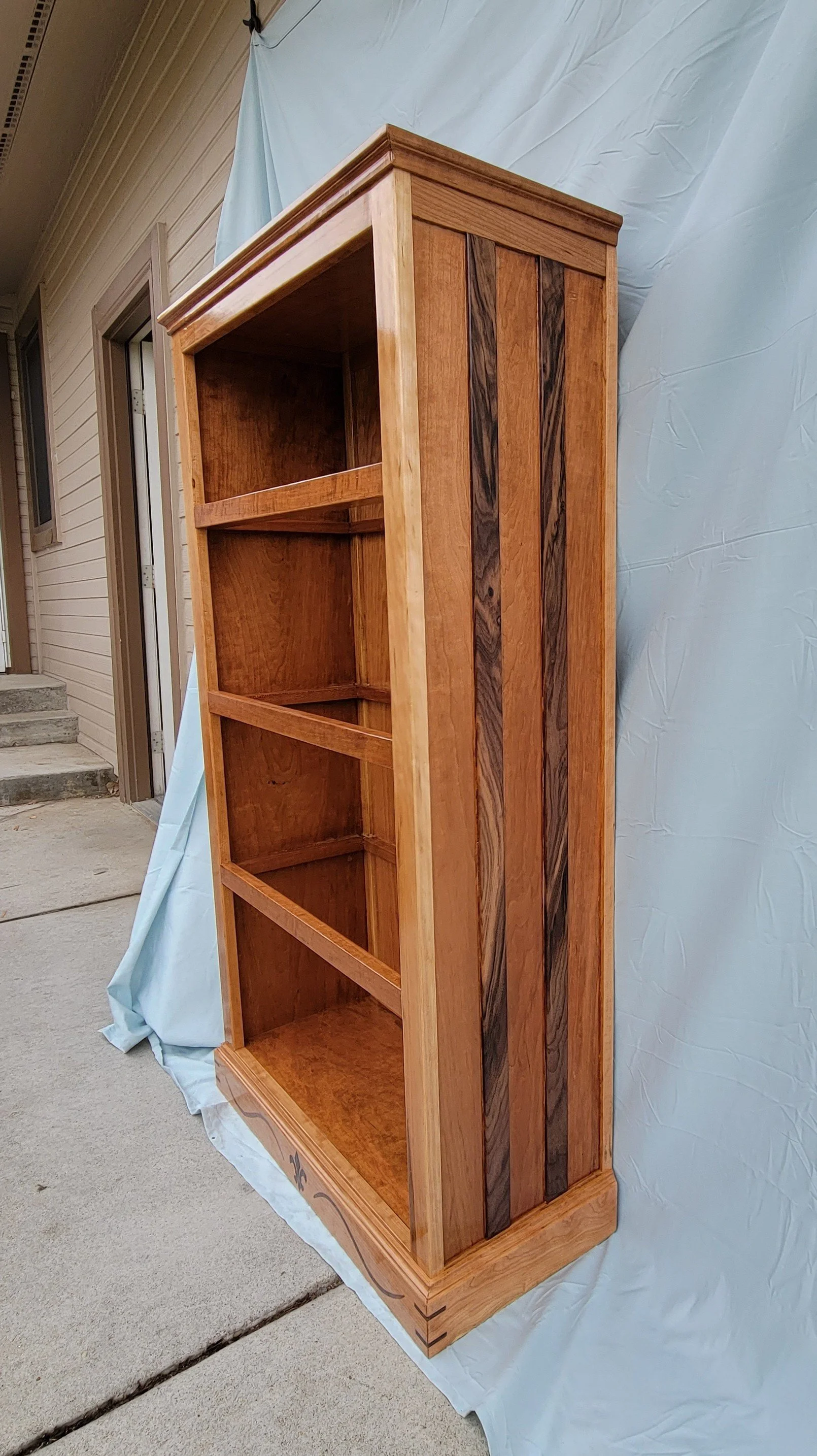 Cherry bookcase with panel stripes
