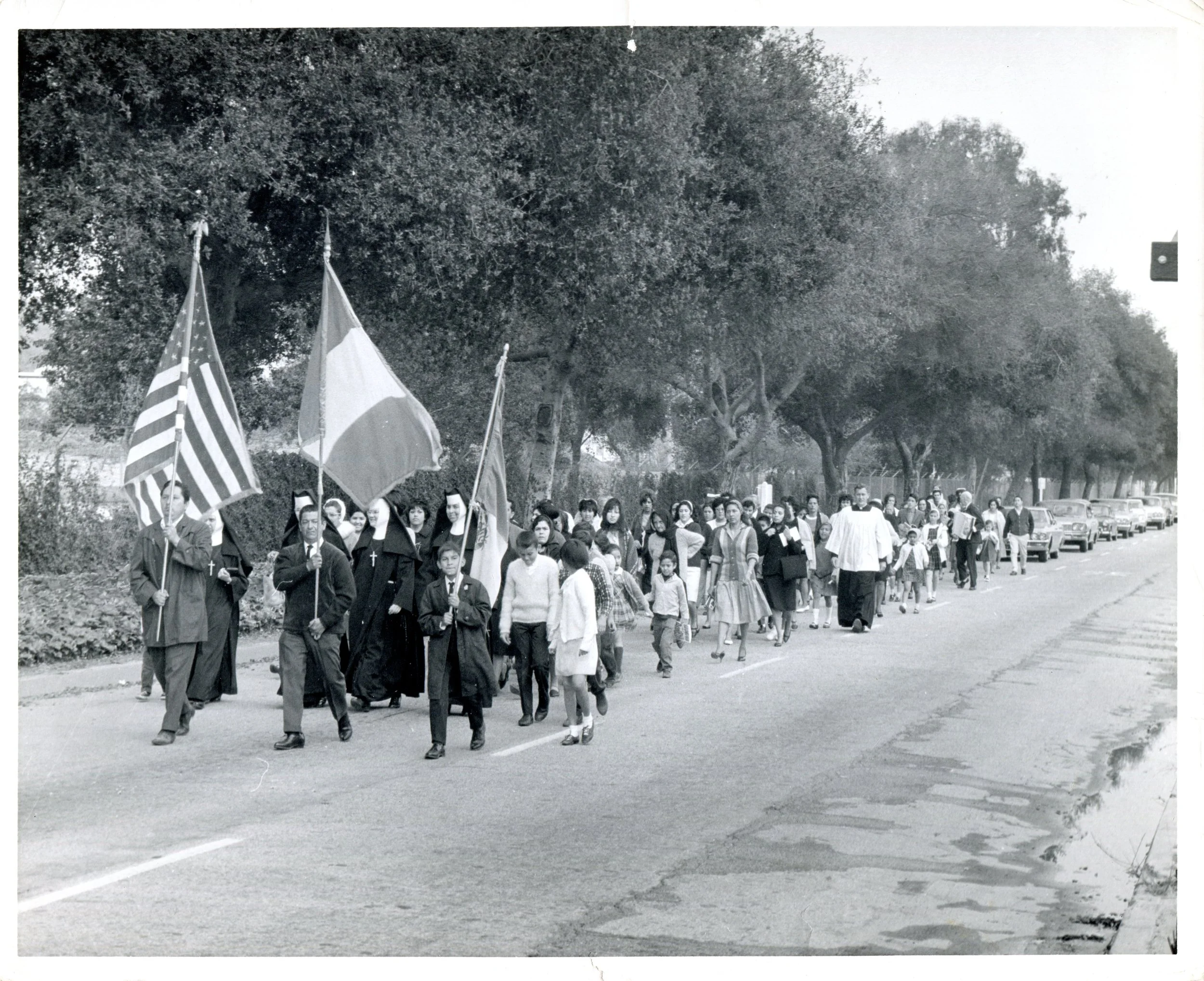 Procession from the Church of the Sacred Heart to the Church of Our Lady of the Assumption in 1968, ahead of the planned demolition of Sacred Heart Church in order to build Claremont Boulevard.