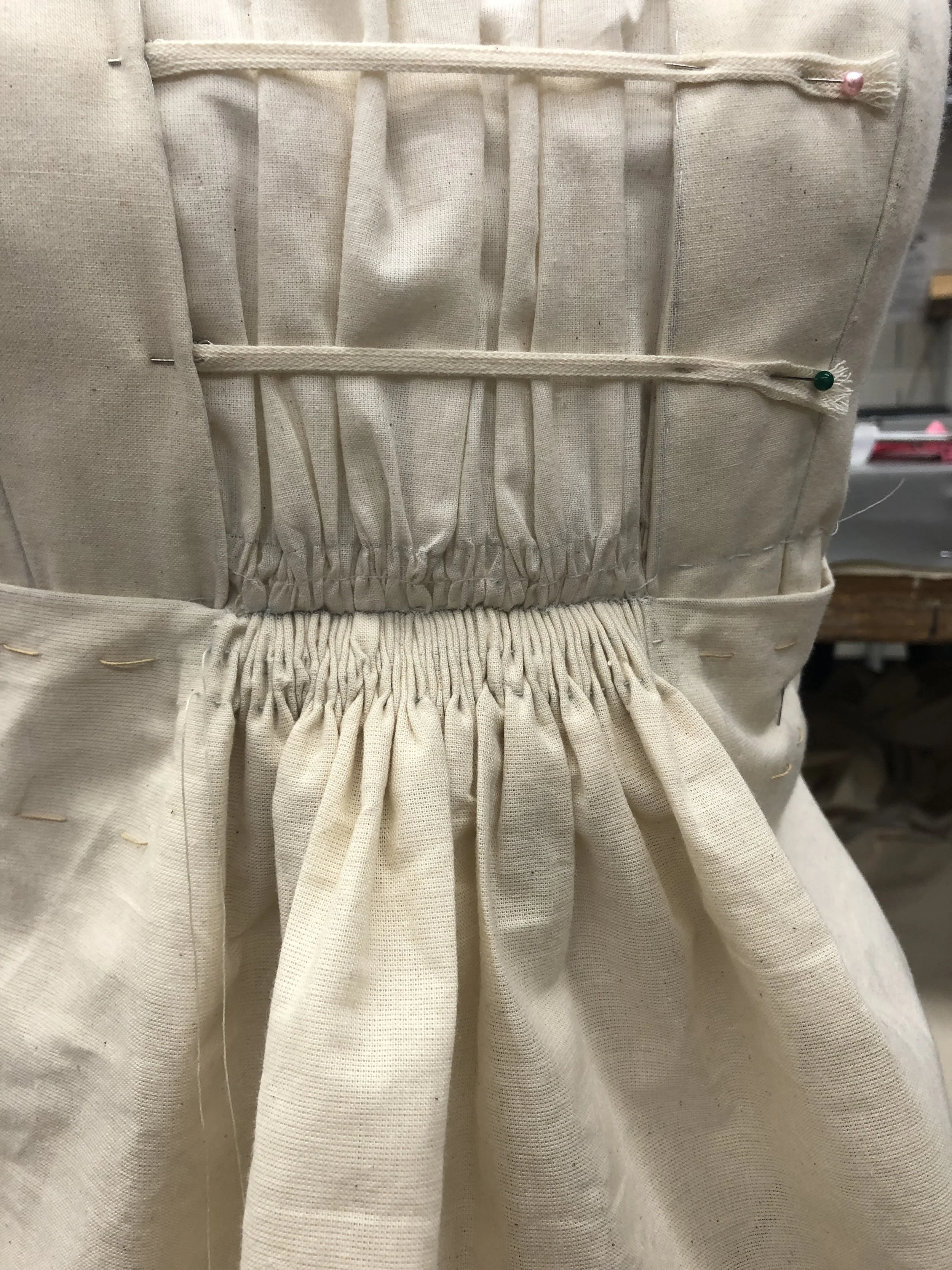 Center front skirt gathers, hand sewn like tiny cartridge pleats