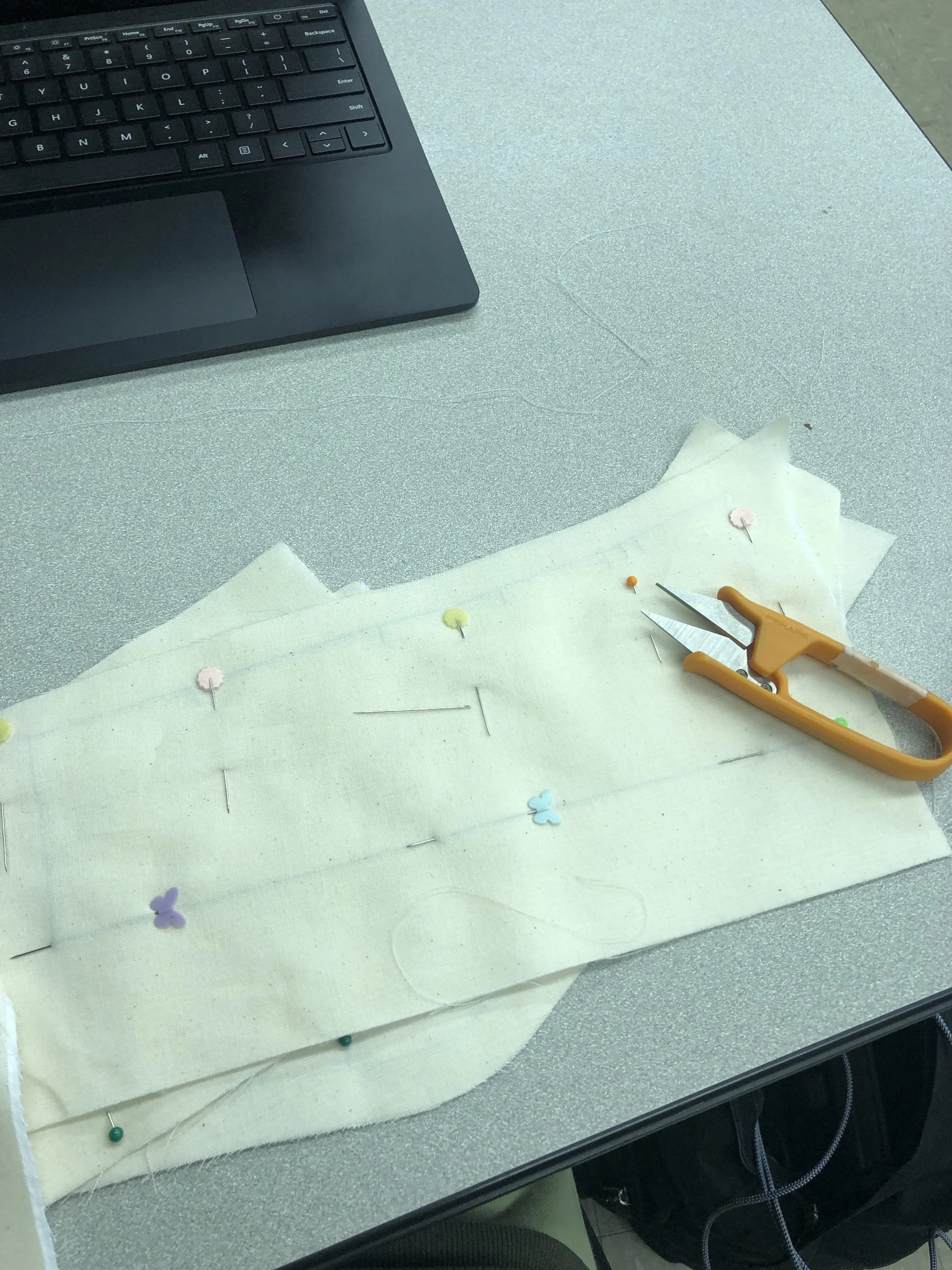 Hand-basting the flat-lined layers together