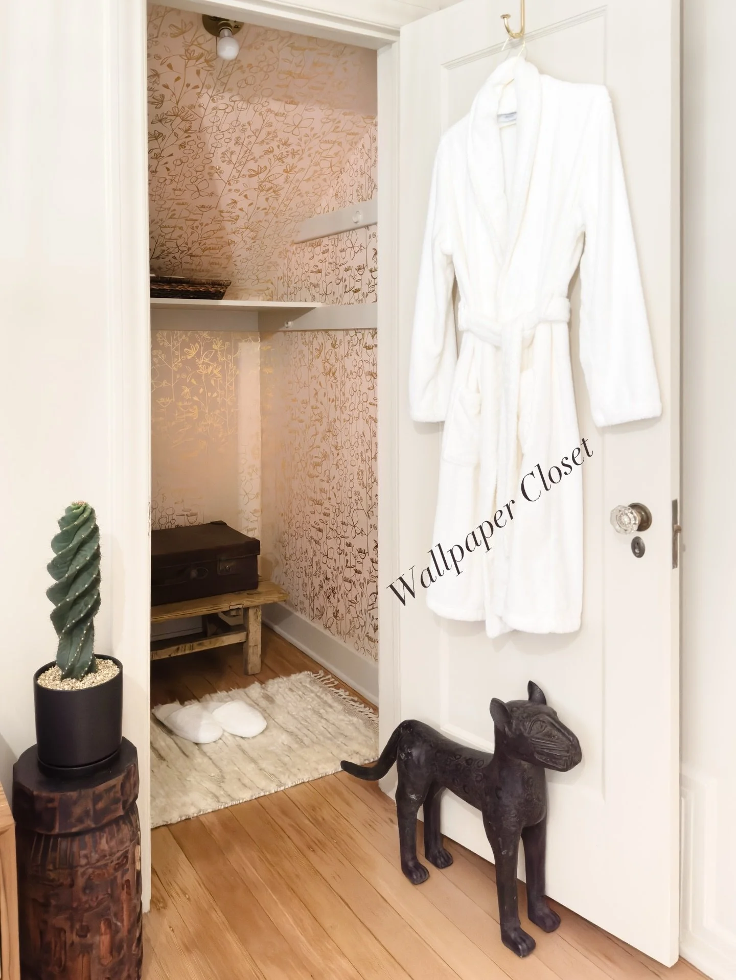 Wallpaper in a closet is one of those quiet decisions that changes how a room feels.

This space is wrapped in a soft blush background with delicate, hand drawn botanicals in a gold metallic finish. The subtle sheen catches the light as you move, add