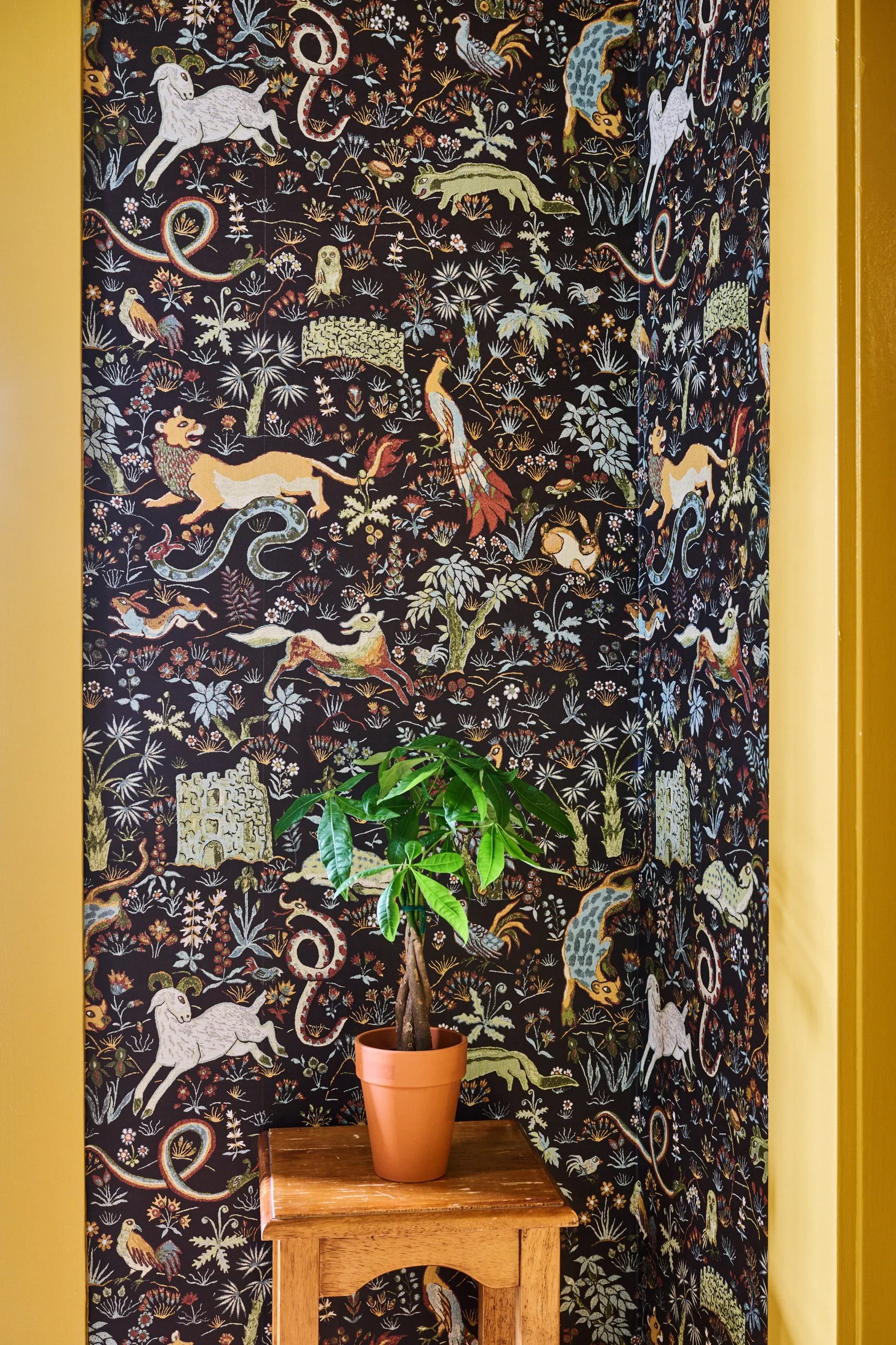 hand illustrated wallpaper with animals, plant, mustard trim