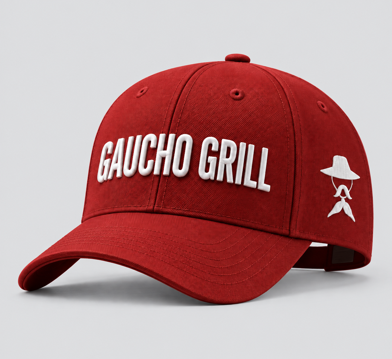 Gorra roja Gaucho Grill en estudio.png