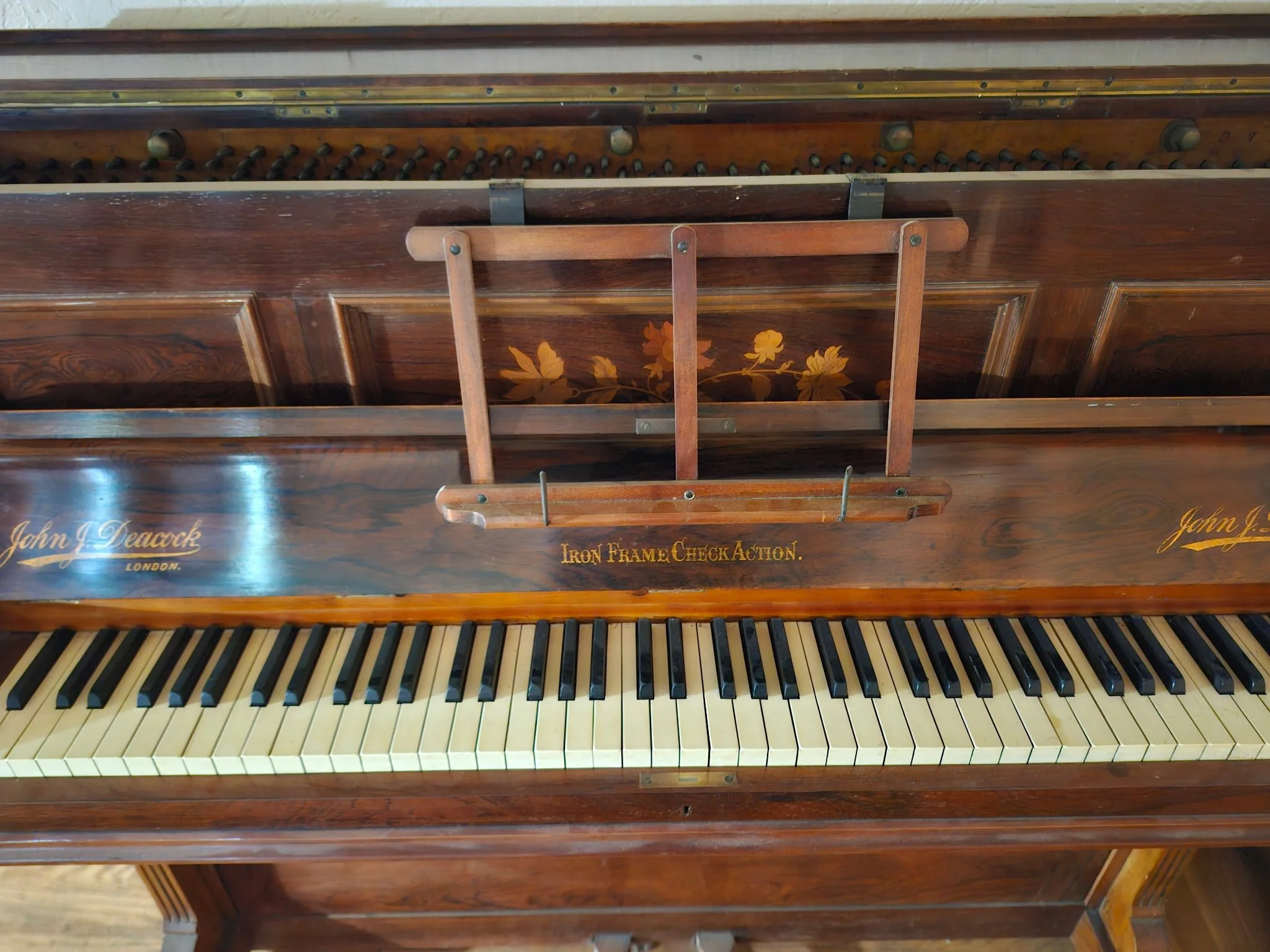 Again, the Dearcock piano. I love how they built the music rack into the top of the piano where you could fold it out to hold the music. This also gives you some idea of the inlay.