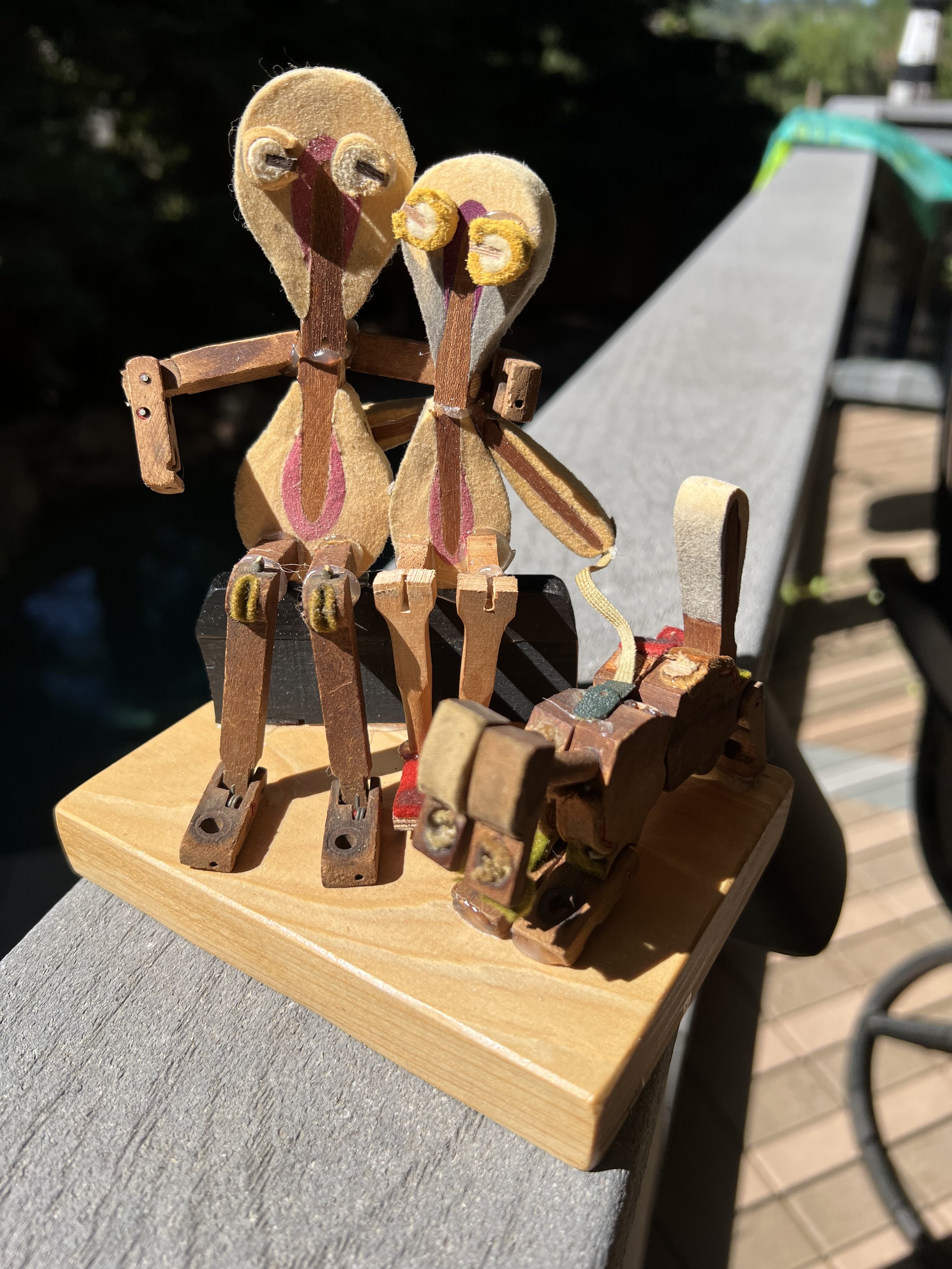 This was for my daughter and her soon-to-be husband. They are sitting together on a black key bench with their arms around each other and their dog next to them.