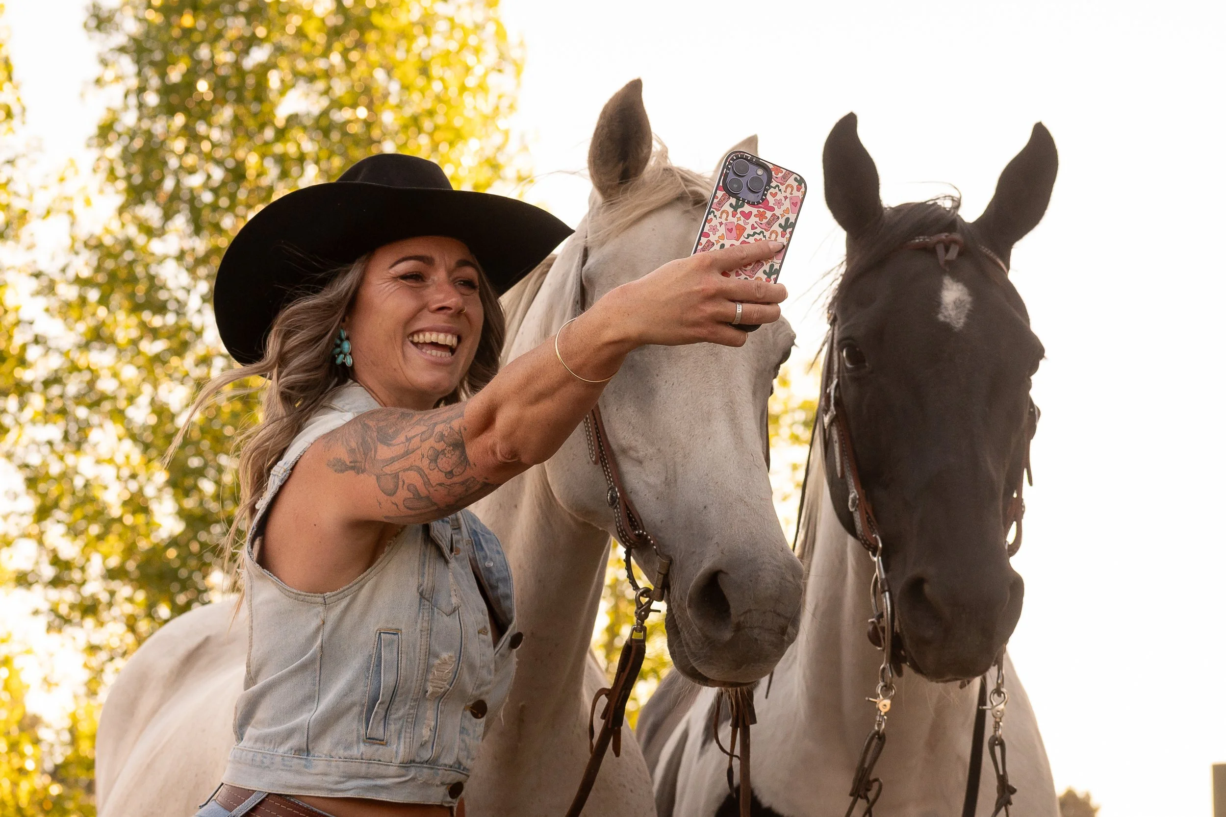 krista-grant-taking-selfie-with-horses-creative-marketing-services