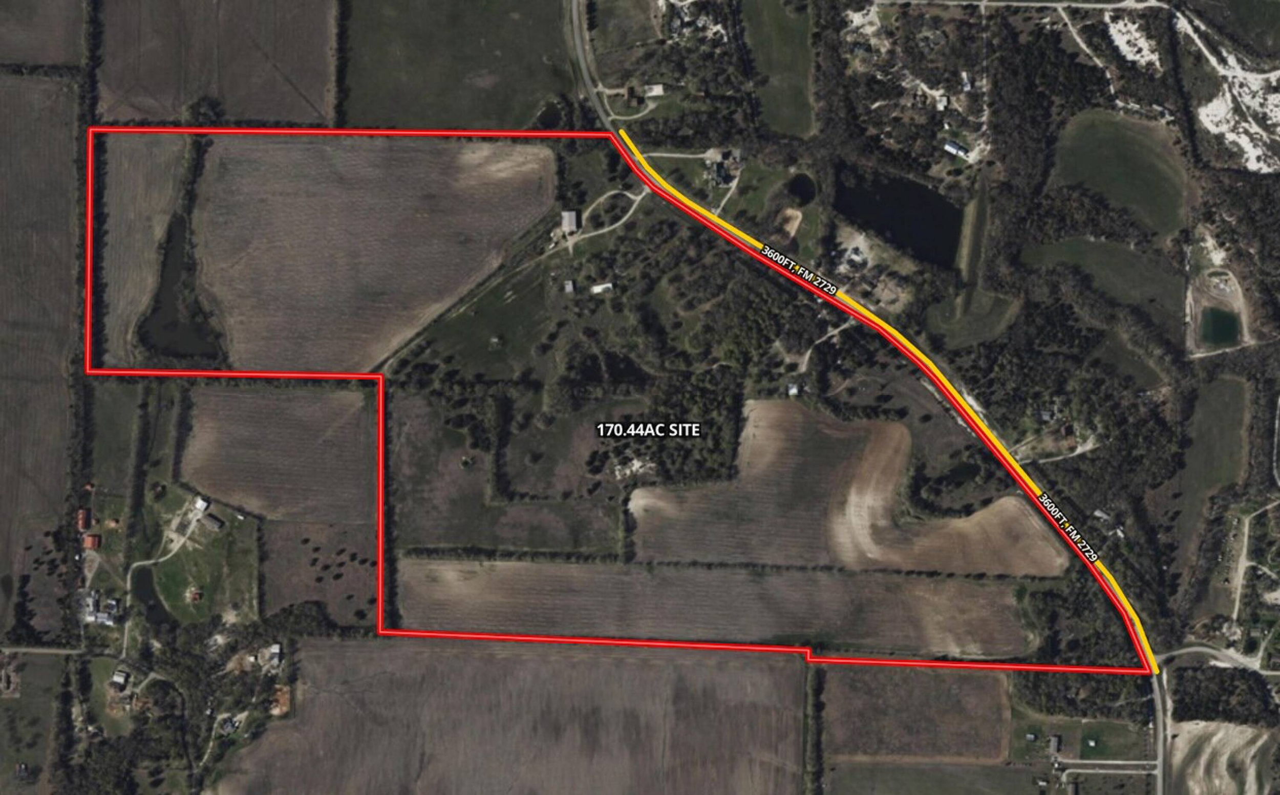 Aerial view of a rural property outlined in red, labeled 170.44 acres, with farmland, wooded areas, and a winding road.