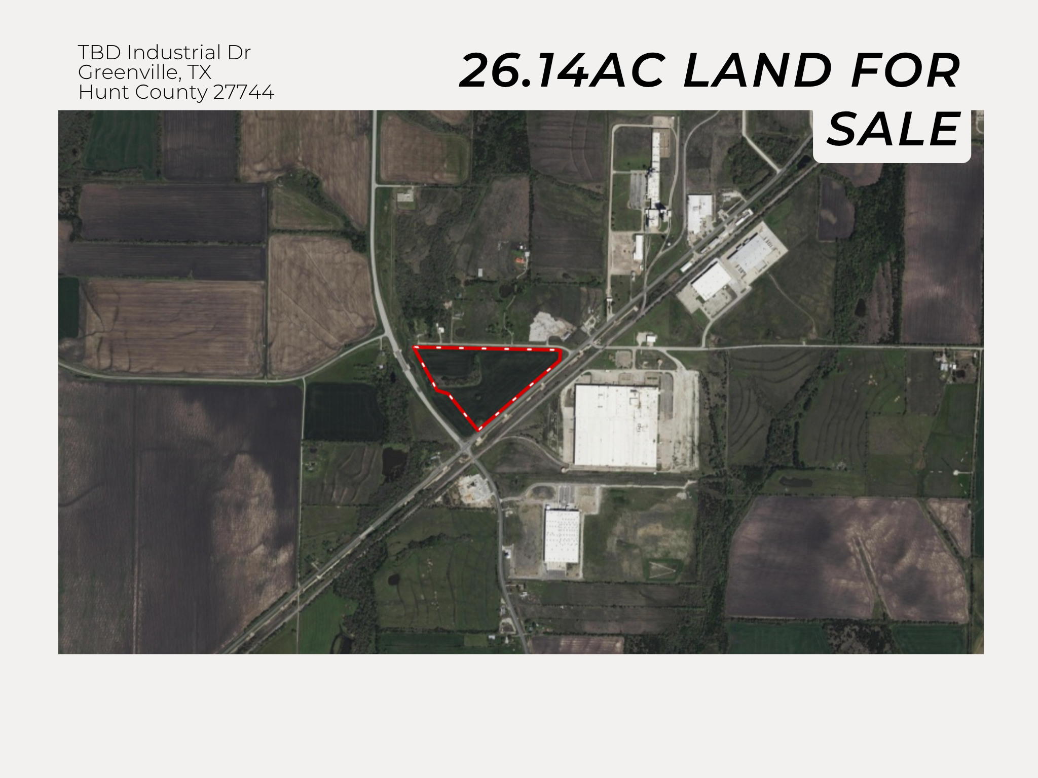Satellite map of land for sale, outlined in red, 26.14 acres, located near industrial and commercial buildings in Greenville, Texas, Hunt County.