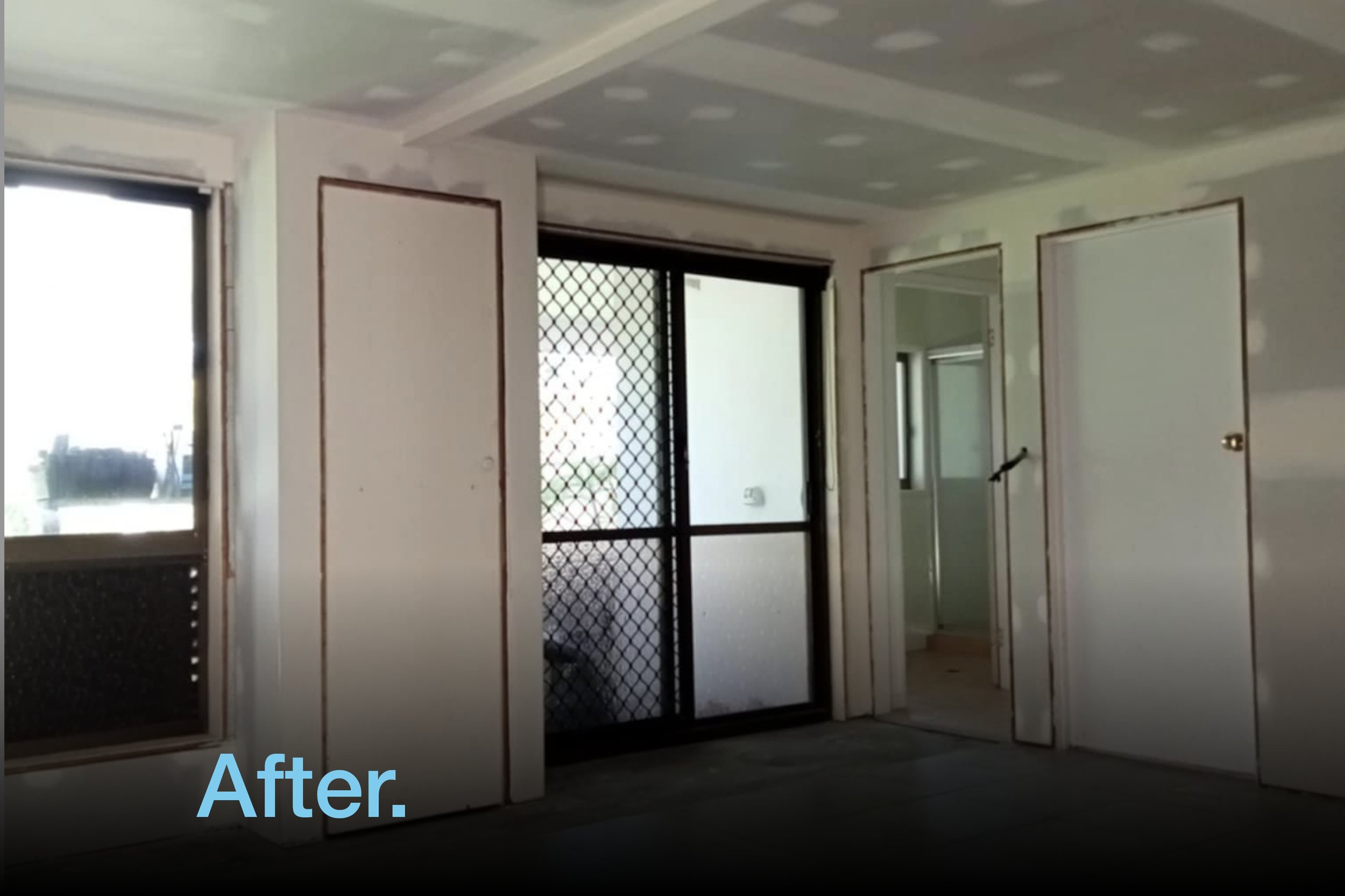 Interior room after plastering renovation with unfinished walls and ceiling, doorways, and a sliding door with a mesh screen.