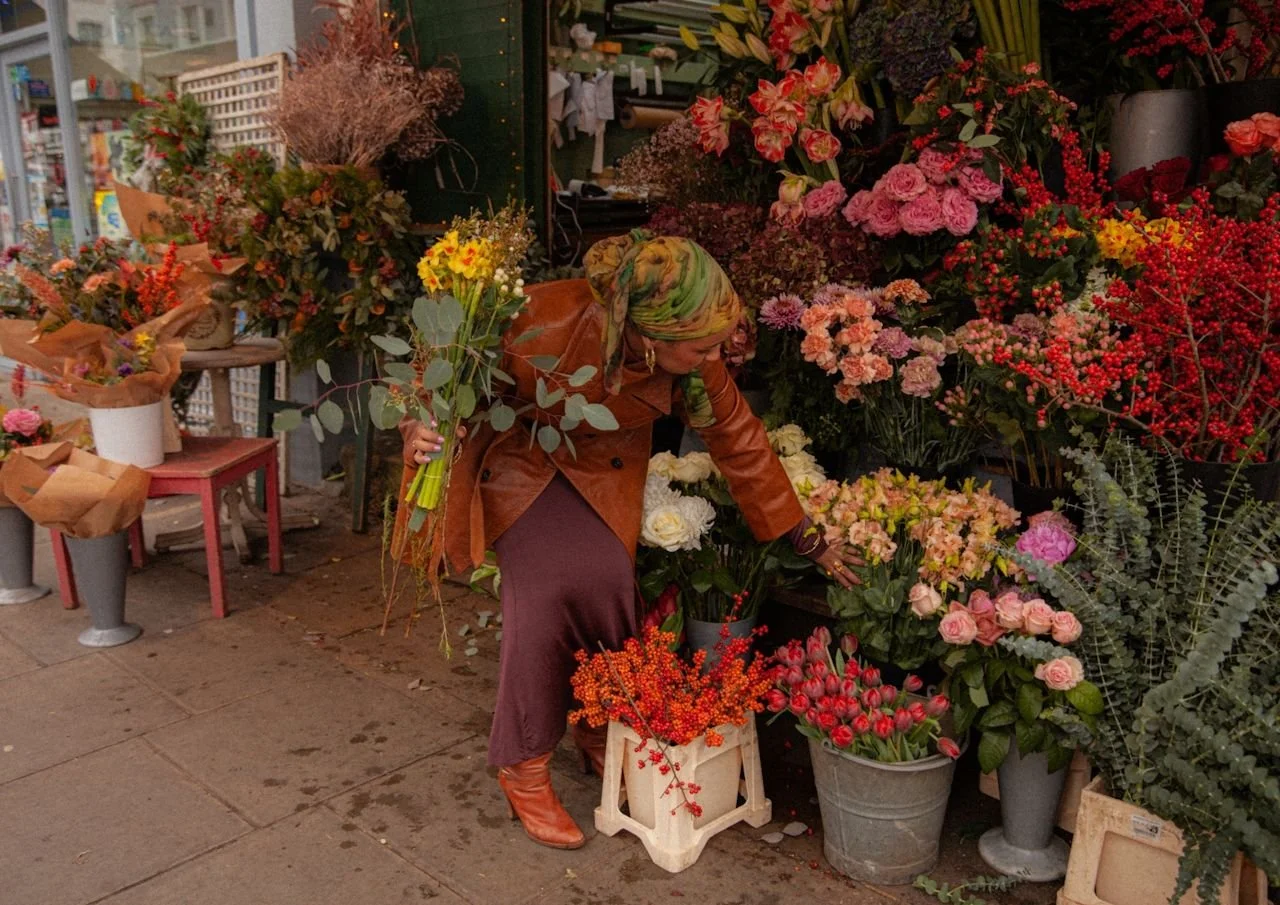 woman choosing flowers from a local boutique flower shop