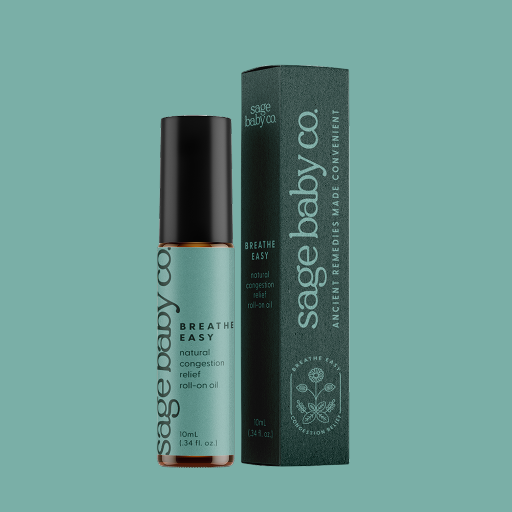 Sage Baby Co. Breathe Easy natural congestion relief roller ball oil for congestion relief, non-toxic, non-invasive, next to its teal packaging box.
