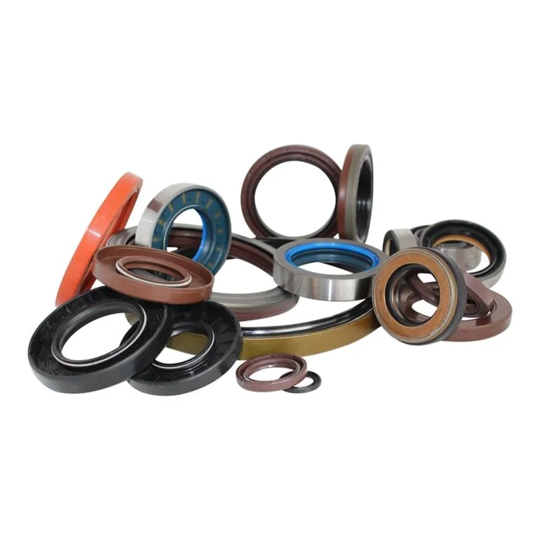 A group of various sized mechanical oil seals with rubber and metal parts, displayed on a white background.
