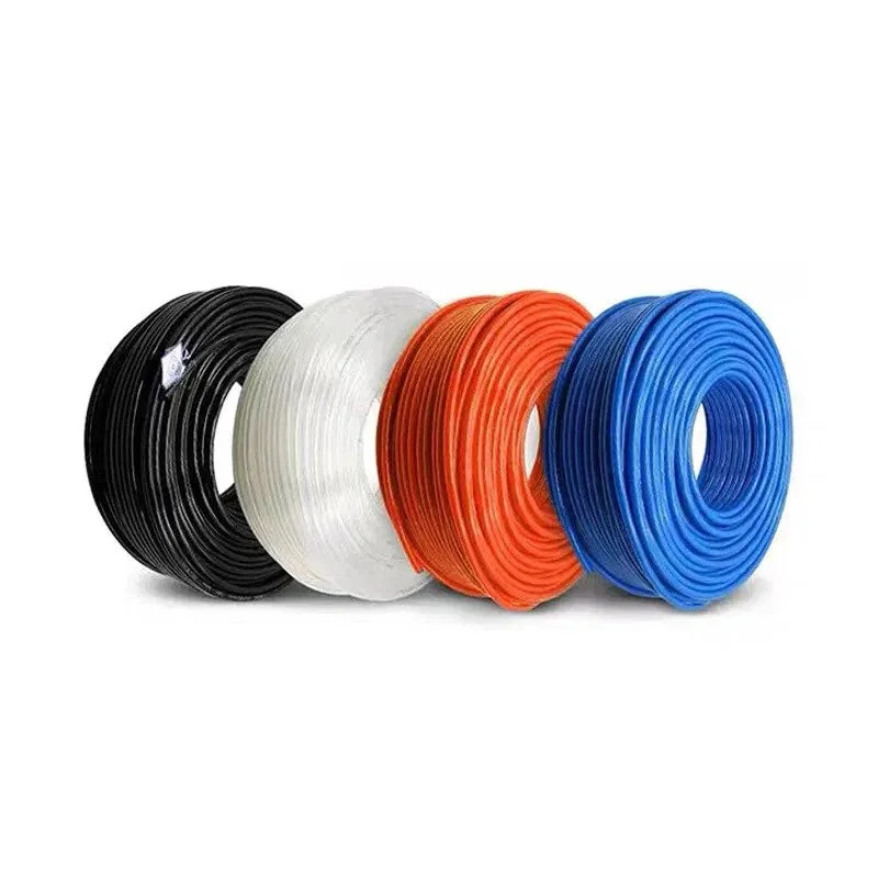 Four spools of electrical wire in black, white, orange, and blue colors, rolled up and placed side by side.