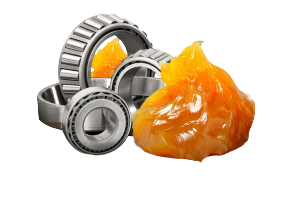 A set of mechanical ball bearings next to a large piece of orange chewing gum.