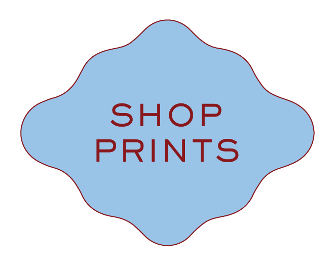 A blue, decorative badge with a red outline and the words 'SHOP PRINTS' in red, uppercase letters in the center.