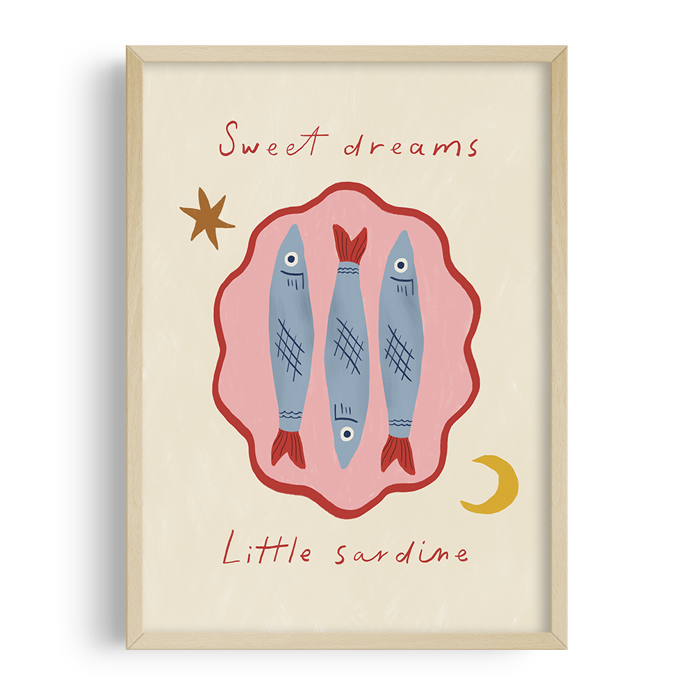 A framed art print featuring three illustrated sardines with facial features and decorative patterns. The background is cream-colored with a pink shape surrounding the sardines. Handwritten text says "Sweet dreams" at the top and "Little sardine" at the bottom, with a stars and a crescent moon illustration.