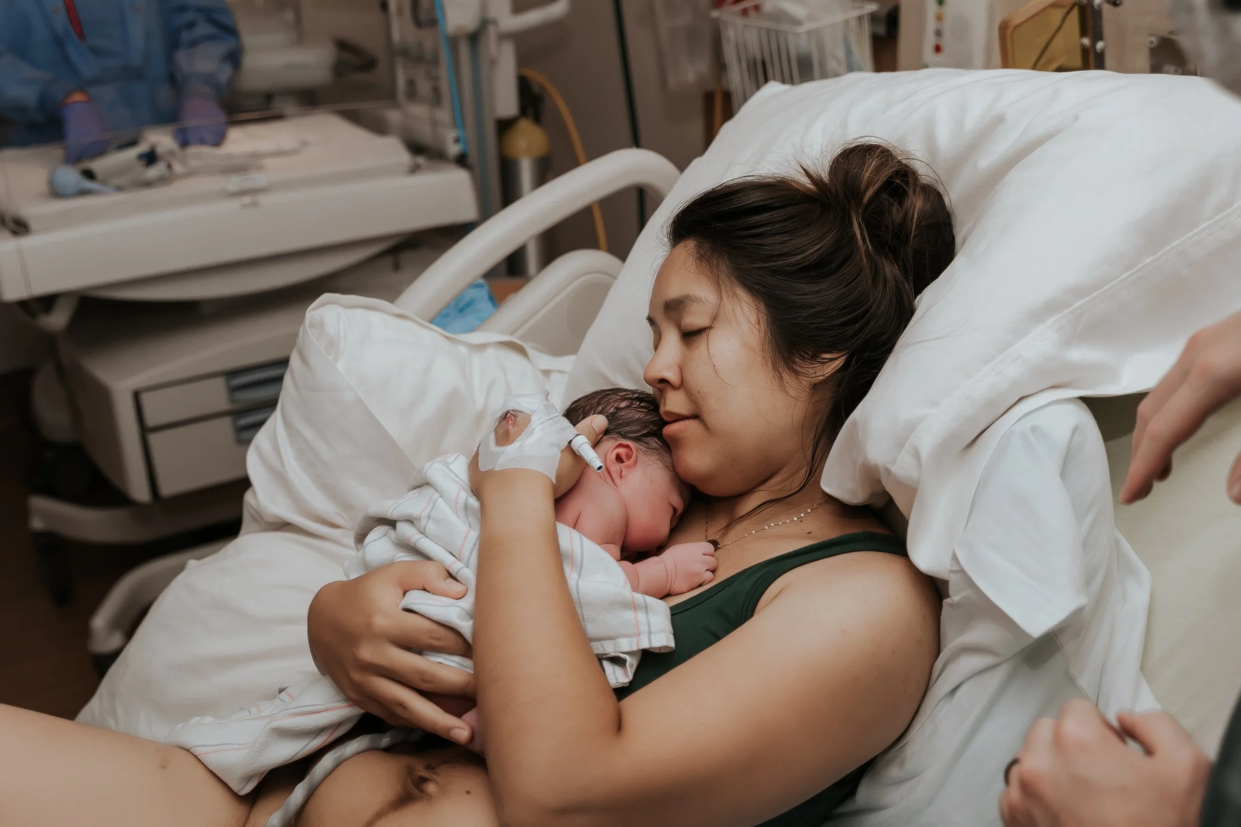 Mom and baby in hospital bed at El Camino Los Gatos Hospital.