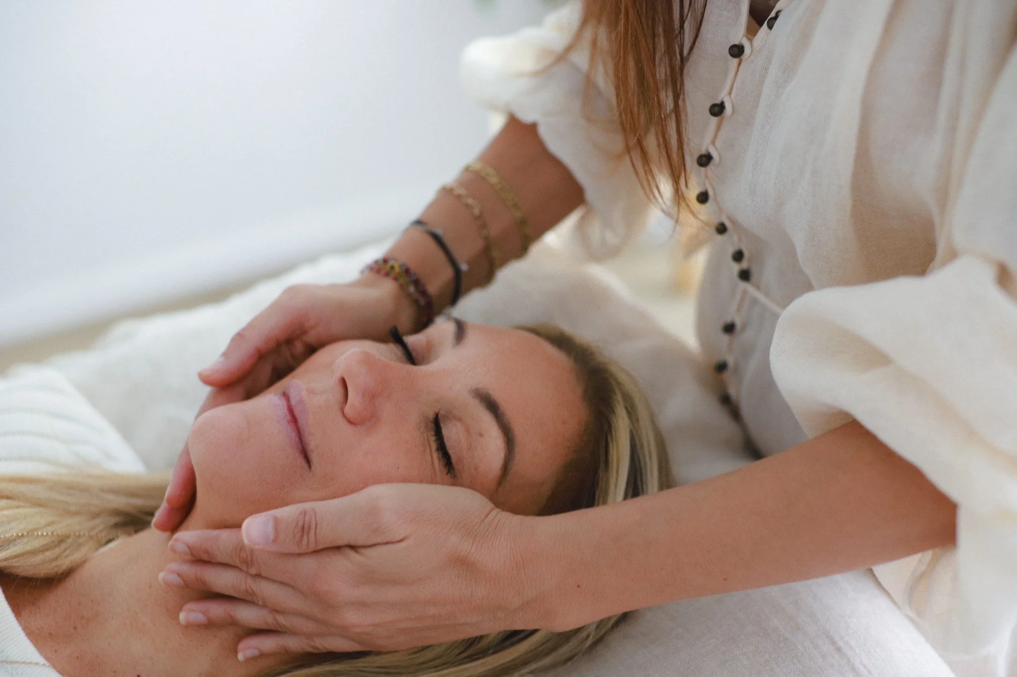 Woman receiving facial massage