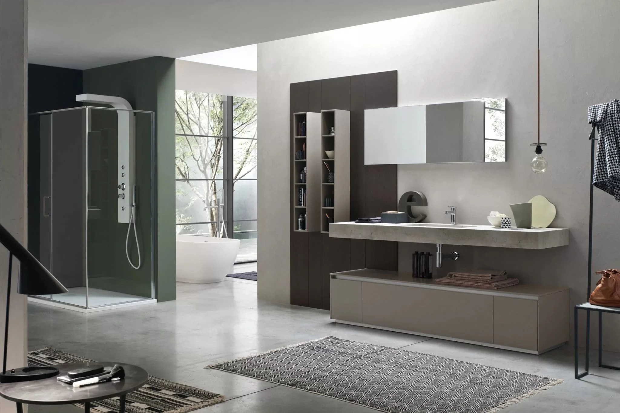 Modern bathroom with glass shower, freestanding bathtub, large mirror, dark wood cabinetry, and minimal decor.
