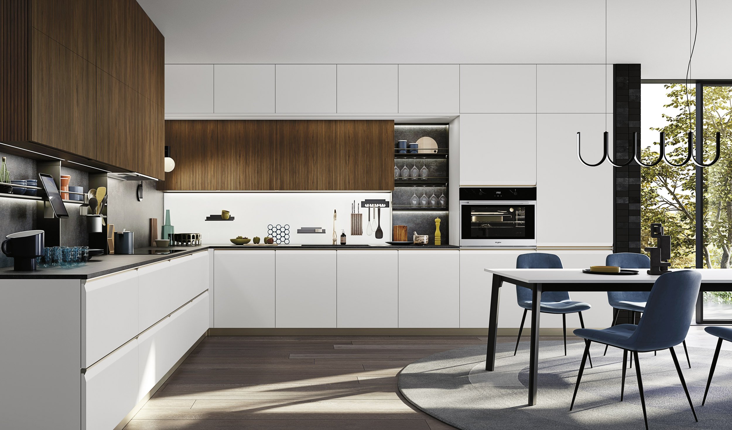 Modern kitchen with white cabinets, wooden upper cabinets, black countertop, glass storage shelf, built-in oven, dining table with blue chairs, large window showing trees outside, black chandelier, and a circular rug on wooden floor.