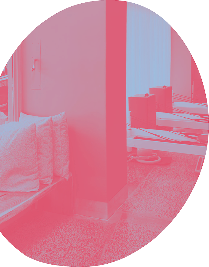 Bright and modern Pilates studio interior with professional reformer machines and equipment